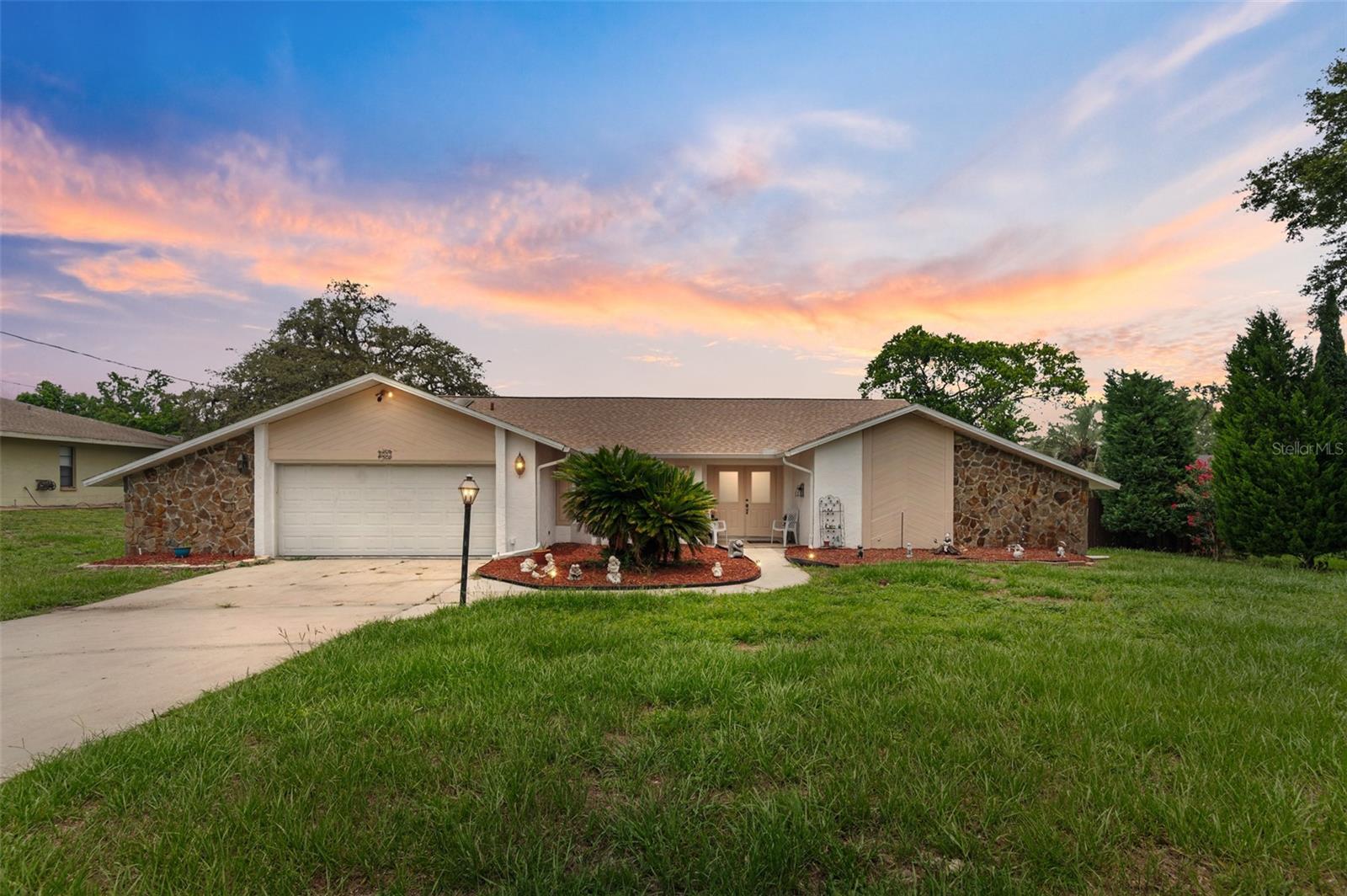 Located in the desirable River Country community, a deed restricted community with very low HOA fees of $125 Annually! Sitting on 1/2 of an acre lot with a FENCED in backyard. NO BUILD BEHIND so plenty of peace and quiet. Step inside through elegant double front doors into a welcoming layout featuring a sunken living room and a cozy family room complete with a fireplace—perfect for those cooler evenings. This 4-bedroom, 2-bathroom POOL home includes a 2-car garage and a screened lanai, ideal for relaxing or entertaining. NO FLOOD ZONE. High & Dry. ROOF 2022. HVAC 2016. High Ceilings as soon as you walk in. Ceramic tile throughout offers a clean, updated feel. Conveniently located just off Route 19, you’ll be close to shopping, dining, and medical facilities, with Tampa and Orlando just a short drive away. Plus, you're only a quick trip from world-famous beaches and beautiful parks. This hidden gem won’t last—schedule your showing today! Less than 5 minutes to Weeki Wachee Springs State Park and less than 10 minutes to Rodgers Park.