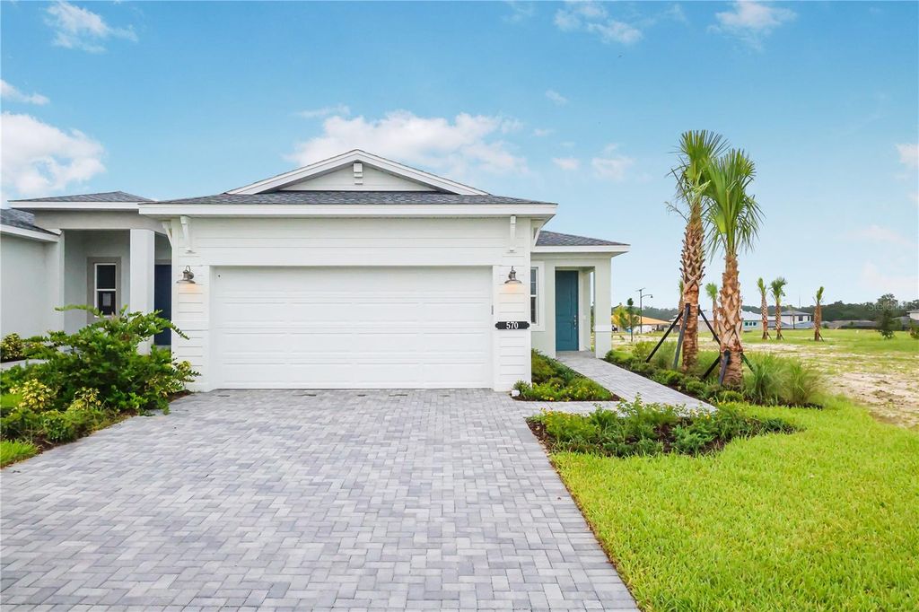 Photo of 570 Hammock Oaks Boulevard, Lady Lake, FL 32159 (MLS # W7886354)
