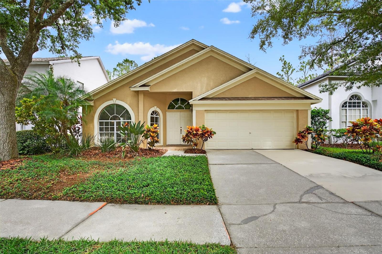 Welcome to 17728 Long Ridge Road, a beautifully maintained one-story home located on a quiet cul-de-sac in the prestigious, guard-gated community of Hunter’s Green. This 3-bedroom, 2-bath split-plan home offers a spacious and open layout with vaulted ceilings and conservation views—no rear neighbors for added privacy.
The roof was replaced in 2016, the water heater installed in 2017, and the stainless steel appliances also date to 2017. The home features granite countertops in the kitchen, a breakfast bar, and a sunny breakfast nook overlooking the backyard. The master suite includes double-door entry, vaulted ceilings, a custom walk-in closet, and an ensuite bathroom with dual sinks, a garden tub, and a separate shower.
Sliding glass doors from the family room open to a large, covered patio and extended screen-enclosed lanai—perfect for relaxing or entertaining. Additional features include fresh exterior paint and great curb appeal.
Located in the heart of New Tampa, Hunter’s Green offers 24-hour manned security, parks, tennis courts, a private golf course, fitness center, and scenic walking and biking trails. Conveniently close to I-75, USF, Moffitt, and some of the best dining and shopping in Tampa. Zoned for top-rated schools, this home blends lifestyle, location, and long-term value. Schedule your private showing today!