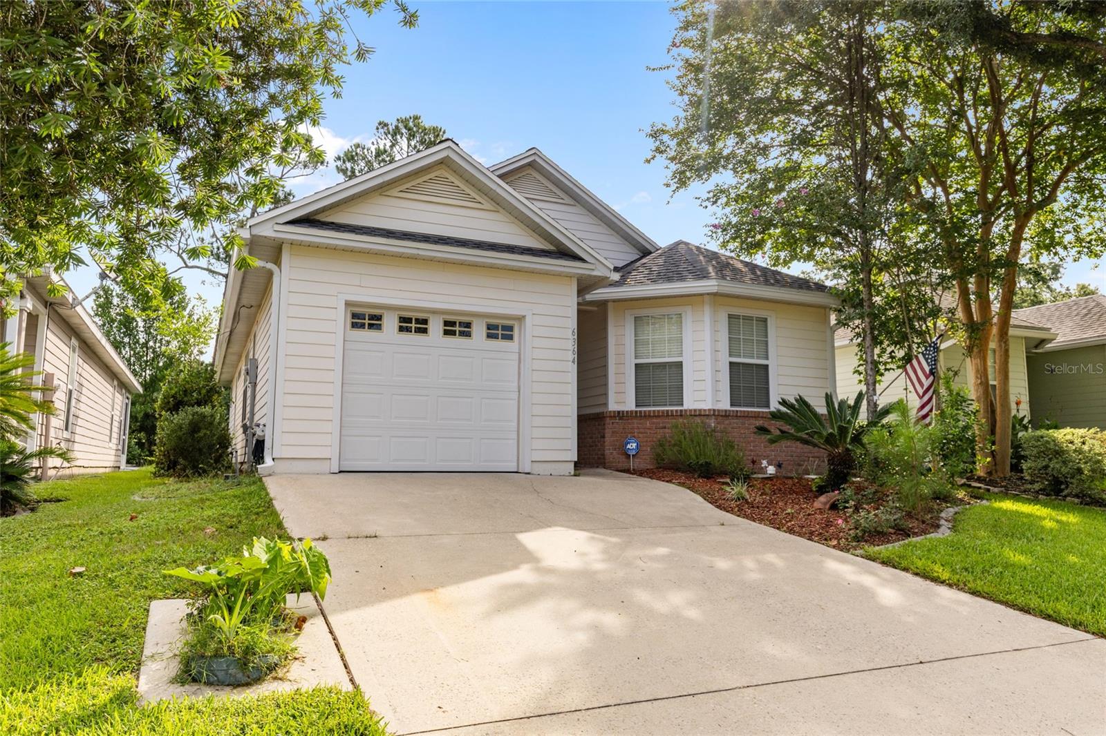 Charming home with lots of light in the gated community of Turkey Creek. Bring your golf clubs! The spacious screened porch overlooks the 1st hole's carefully manicured fairway. Inside, the kitchen features a double door refrigerator(2025), range, dishwasher and microwave and overlooks the spacious living area. There is newer LVP in the bedrooms and durable ceramic tile in the common areas. No carpet! Roof replaced in 2024! Turkey Creek is uniquely situated between Gainesville and Alachua providing convenience and serenity. The neighborhood features a community pool, clubhouse and a full 18 hole golf course. Schedule your showing today!