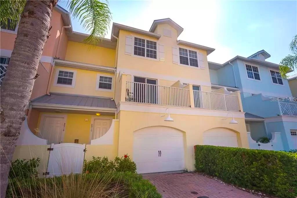 Currently Available April 1 - 2026.. Discover the ultimate in comfort and convenience with this beautifully appointed and fully furnished guest home. Perfect for remote workers or anyone seeking the very best, this residence is equipped with a premium Wi-Fi and cable package, offering blazing-fast 200 Mbps internet. Stream movies in 4K, connect multiple devices with ease, and enjoy HBO and other premium channels. Located just a short walk from the world-famous Siesta Key Beach, as well as top-notch restaurants, a marina, shopping, and more, this 3-story, 3-bedroom, 2.5-bathroom townhome is ideally situated west of Tamiami Trail (Route 41). The home boasts a private garage with additional parking conveniently available for a second car. Each of the three spacious bedrooms features walk-in closets. The entire first floor is dedicated to the luxurious primary bedroom suite, complete with a spa tub, dual vanities, a walk-in shower, and a private covered outdoor space. The guest bedrooms, located on the third floor, are thoughtfully separated for maximum privacy. The second-floor main living area offers soaring 14-foot ceilings and an open-concept layout, including a fully equipped kitchen, dining, and living space anchored by an 80" TV. Two generous terraces—one facing east and the other west—feature floor-to-ceiling sliding glass doors that flood the home with natural light and provide serene indoor-outdoor living spaces. This home is equipped with a dual-zone central AC system for optimal comfort during your stay. Outside, the meticulously maintained tropical grounds include a resort-style heated swimming pool just steps from your front door, providing the perfect oasis for relaxation. Whether you're here for work or leisure, this home has everything you need for a memorable stay. Please note that taxes and fees apply to the base advertised rate. Book your dream getaway today! Currently not available Until April 1 - 2026. Owner may consider Shorter Term at increased rate per month - taxes and fees would apply.