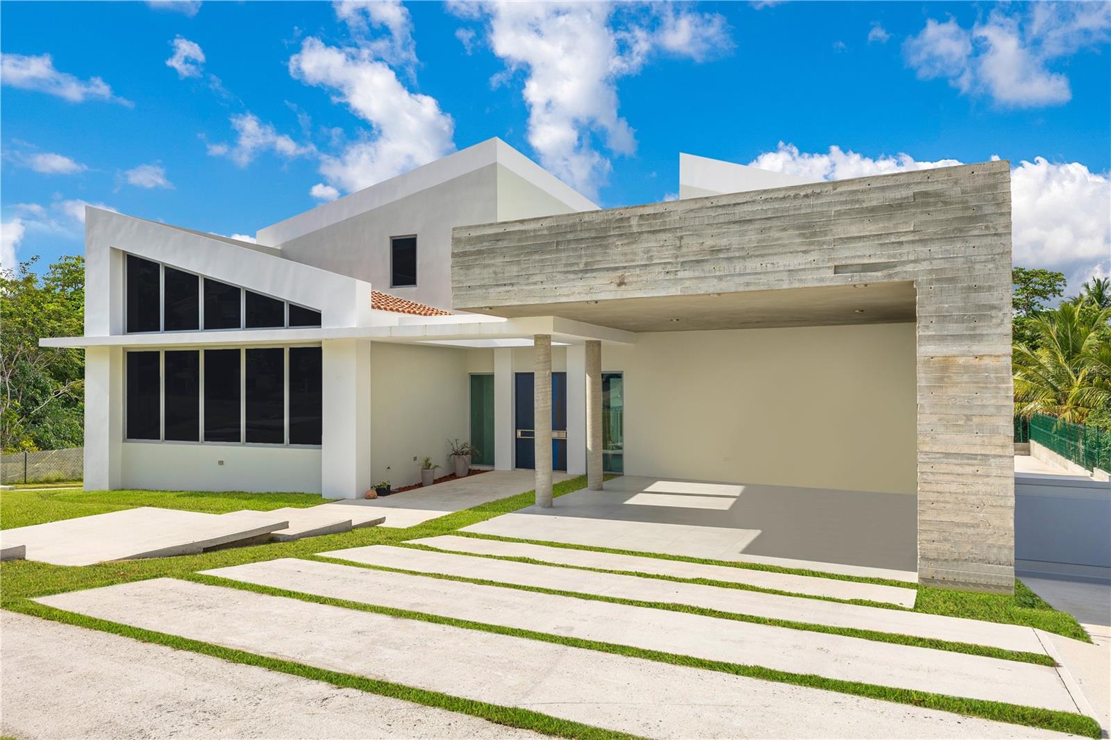 Located in the exclusive Surfside neighborhood within Palmas del Mar, this newly built, architecturally refined residence is the most modern home in the entire community—just a short stroll from the beach. Designed with intention and elevated living in mind, the property offers clean lines, abundant natural light, and a seamless open layout ideal for both relaxed living and upscale entertaining.This home features four generously sized bedrooms, each with its own en-suite bathroom and walk-in closet, as well as a total of five full bathrooms. The primary suite stands out with an immense walk-in closet and wet bar connections, perfect for creating a private lounge experience.Enjoy flexible convenience with two laundry rooms, one in each wing of the home, ideal for multi-generational living or repurposing one as a spacious storage room. Two balconies welcome in the coastal breeze, and a full power generator ensures uninterrupted comfort. As a resident of Palmas del Mar’s renowned Surfside community, you’ll enjoy access to world-class resort-style amenities: beachfront living, golf courses, tennis facilities, an equestrian center, a full-service marina, fine dining, boutique hotels, and The Palmas Academy, one of Puerto Rico’s top bilingual schools. Ownership Costs: CRIM: $3,064.14 semi-annually; Palmas HOA: $1,300/year; PDMU (Water): $50.53/month. This is more than a home, it's a bold statement of modern luxury in one of Puerto Rico’s most celebrated coastal communities. *Some pictures have been virtually staged.