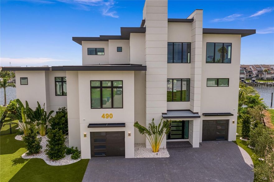 This exquisite home features an all-too-rare amenity found along Central Florida’s West Coast. A deepwater private dock able to accommodate 100-plus-foot yachts that is located just steps away from Tampa Bay Area Premier Builder, JR Structure’s newly constructed, custom-designed residence.

Enjoy the convenience of transitioning from boat deck to patio deck simply by crossing the backyard of this barrier island home. 

With this ease of access, experience year-round excursions and endless opportunities for open water fishing trips to extended waterfront explorations along the Gulf of Mexico. It is all possible thanks to the fully equipped dock sporting three slips,150amp power supply, a 40,000-pound boat lift and jet ski lift.

Built along the banks of Tierra Verde’s Grand Canal, this five-bedroom, five-bathroom and two half-bath residence is truly turnkey ready. Contemporary decor, bold and beautiful wall treatments, lighting fixtures and a Fully Furnished stylish decor professionally designed by DoMA, accentuates this elegant, rare gem.

This light-filled, 5,625-square-foot home optimizes abundant waterfront views with features that include framed glass doors, over-sized windows, wall-to-wall sliding glass doors, and an open floor plan with 12-foot ceilings in the main living area. A soothing cool color palette provides a pleasing contrast to the parcel’s surrounding vibrant foliage, bright blue sky, and sparkling waterfront.

Located in a cul-de-sac within this highly sought-after community, this residence is convenient to St. Petersburg’s vibrant downtown and award-winning beaches like Fort De Soto Park and Egmont Key. Its idyllic location is understandably longed for as well as uncommonly available.

Unparalleled and unobstructed views can be enjoyed from bedrooms to balconies, the main living areas to the lanais and from the poolside patio, creating the perfect indoor/outdoor lifestyle at this luxury island escape. Wooden staircases and a wood-paneled interior elevator provide easy access to all areas and every level.

The backyard is bordered by a new 194-foot seawall. It rivals a luxury vacation resort with its inviting open-air deck overlooking a heated saltwater pool and spa and adjoining outdoor kitchen, al fresco and covered dining areas and private putting green, plus a fire table.

The sleek interior kitchen is accented by Cambria® solid quartz surfaces, custom cabinetry and top-of-the-line Wolf and SubZero appliances and features free-standing islands for both meal prep and seated dining. 

Step into the home’s entryway directly from the paved driveway or through the connecting four-car garage and workspace encompassing 2,480 square feet. A formal dining room framed by windows on three sides, home office space, indoor/outdoor leisure room with wet bar, large laundry room with counters and cabinets and primary bedroom complete with a roomy walk-in closet, separate laundry facilities, spacious bathroom with dual vanities and double walk-in showers round out the many amenities and attributes this one-of-a-kind home delivers.  Seller open to partial luxury trade of home, boat or airplane.  (No Flooding with either Helene or Milton)