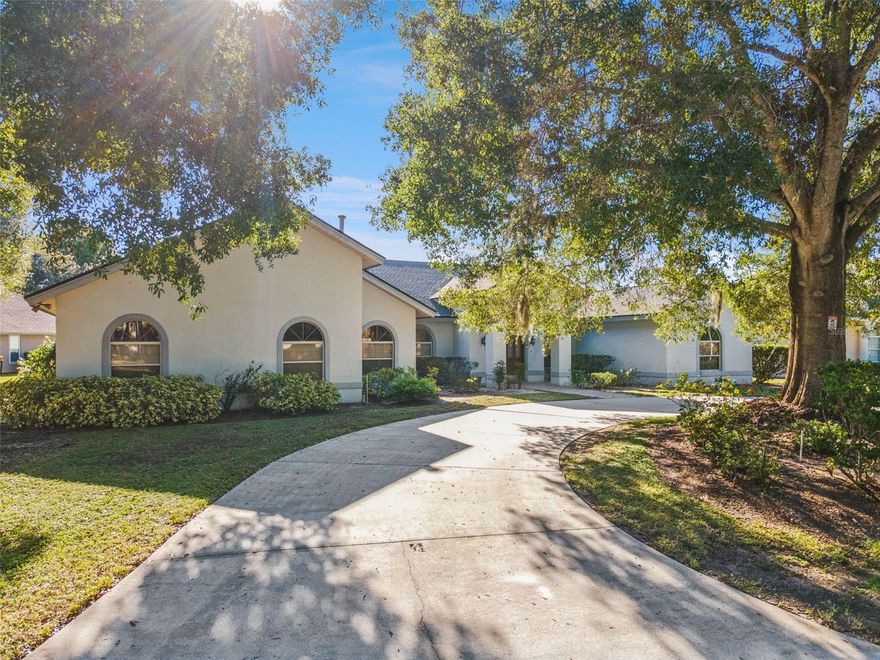 Welcome to this refined sanctuary where timeless elegance meets Florida’s tranquil landscape. On a premium golf-adjacent lot within the guarded, gated community, 2964 Plantation Road blends gracious scale, luminous living and multi-generational flexibility in one seamless layout. Upon arrival, you are greeted by mature landscaping, a circular drive and side-entry access to a three-car garage, with stunning views of golf course fairways and water views. Enter inside to discover over 3,600 square feet of thoughtfully designed space. Formal living and dining rooms flow with grace and purpose, while a custom wet bar offers effortless entertaining. The split floor plan is crafted for privacy and connection. The primary suite is complete with dual vanities, walk-in closets, a garden tub, separate shower and private pool access. On the opposite wing rests an en-suite bedroom, complete with full bath and independent access. Ideal for multigenerational living, guest privacy or an upscale in-law suite. Two additional bedrooms share a Jack and Jill bath, while a half bath serves daily living or poolside use. Gourmet gathering begins in the kitchen including a center island with gas range, generous counter space and views out toward the lanai. The breakfast nook offers a comfortable space for everyday dining, complemented by a nearby utility room and a flexible bonus room. Going outside, this home’s soul lives in its outdoor realm. A pool and spa, and a summer kitchen complete with built-in grill, sink and prep station, invite all-day alfresco living. A covered lanai frames those golf and pond vistas beautifully, offering shade and breeze for lounging or entertaining. Cypresswood is a full-amenity, guard-gated community with an 18-hole golf course, clubhouse with restaurant and lounge, tennis and pickleball, fitness/wellness center, and social programming.
