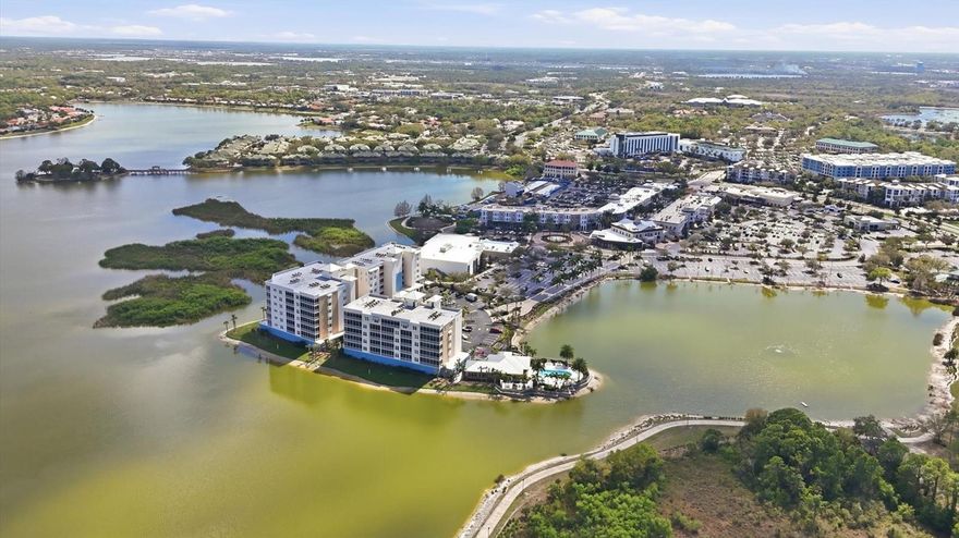 Rare penthouse opportunity at Waterfront at Main in Lakewood Ranch. This stunning 3-bedroom, 3.5-bath + den residence offers elevated luxury living with expansive water views and an exceptional location just steps from Lakewood Ranch Main Street.

Designed with an open, light-filled floor plan, the home features high ceilings, designer finishes, and floor-to-ceiling sliding glass doors that open to a spacious screened balcony overlooking Lake Uihlein; perfect for enjoying breathtaking sunrises and tranquil waterfront scenery. The gourmet kitchen is beautifully appointed with quartz countertops, custom cabinetry, premium stainless steel Monogram appliances, and a large center island ideal for entertaining.

The spacious primary suite serves as a private retreat with balcony access, walk-in closets, and a luxurious spa-inspired bath with dual vanities and a walk-in shower. Each additional bedroom includes its own en-suite bath, providing comfort and privacy for family or guests, while a convenient powder bath serves the main living area.

Additional highlights include a separate den/study area, storage locker, and secure under-building parking. Residents enjoy resort-style amenities including a lakefront pool and spa, fitness center, clubhouse, outdoor fire pit, and gated entry.

Ideally located just steps from restaurants, shopping, entertainment, and community events on Main Street, this penthouse offers the perfect blend of luxury, convenience, and vibrant Lakewood Ranch living.