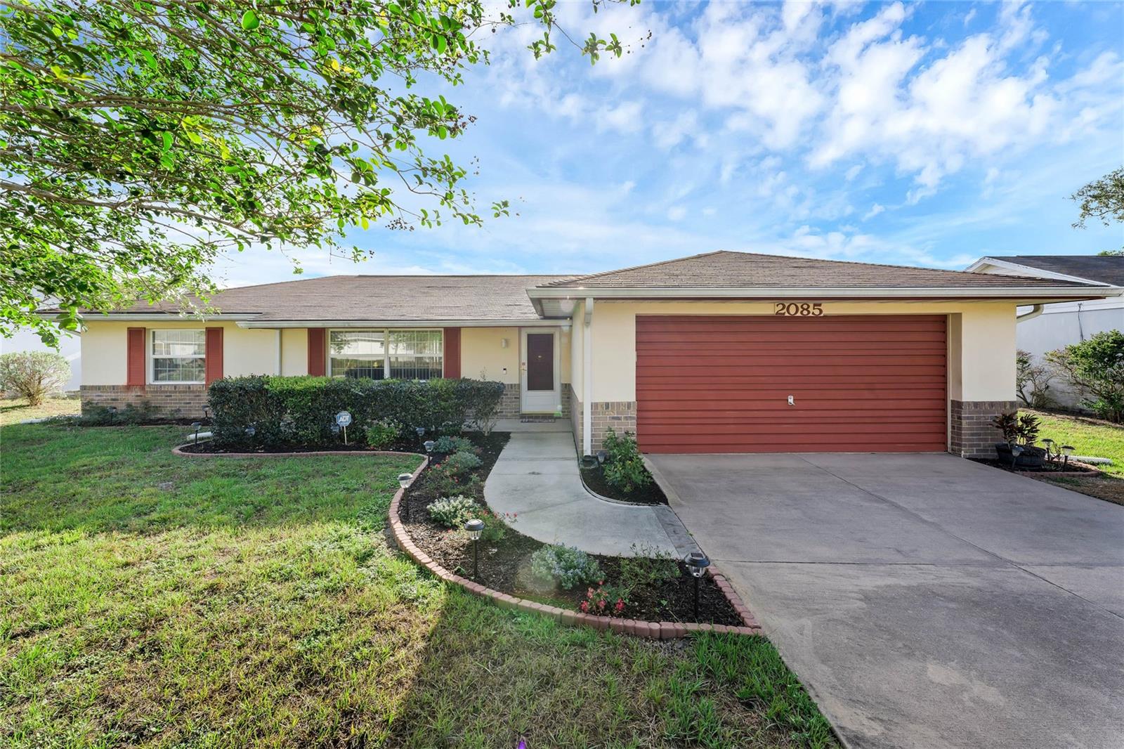 Well cared for and ready to move in 2 bedroom and 2 bathroom home in Deltona. Nice sized kitchen with breakfast bar and lots of counter space. Separate dining room with walkout to the enclosed patio overlooking the backyard. Large living room for the family! Master bedroom suite and walk-in closet. New paint and newer water heater. 2-car garage! No Hoa! Located within minutes to I4 between Orlando and Daytona.