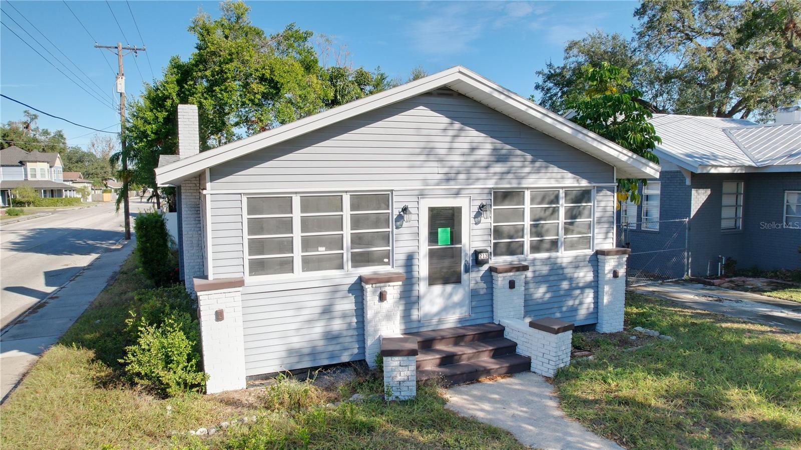 This beautifully maintained 1920s bungalow offers the perfect blend of historic charm and modern updates. The home features 2 bedrooms and 2 baths as well original hardwood floors, updated kitchen with granite counters and stainless steel appliances, and renovated bathrooms with stylish finishes. Enjoy the enclosed front porch, perfect for a home office or reading nook. The backyard features a covered porch, 2-car parking pad, and a detached storage shed. Roof and A/c 2015 and water heater 2023 . Located just minutes from Downtown Tampa, Armature Works, and Seminole Heights’ best restaurants and shops. Don’t miss this chance to own a piece of Tampa history!