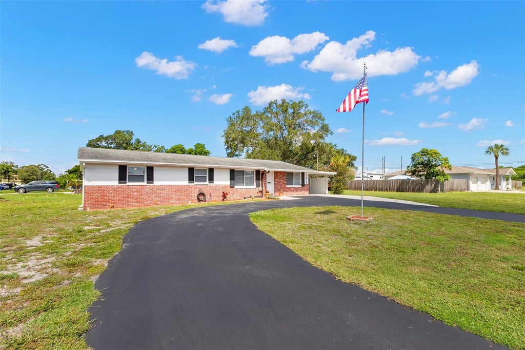 Photo of 6100 Woodrow Wilson Boulevard NE, St Petersburg, FL 33703 (MLS # TB8545895)