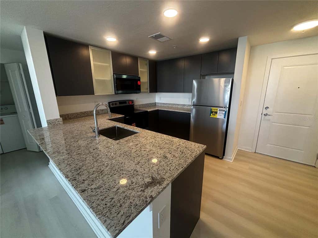 Photo of 5563 Millenia Park Boulevard #223, Orlando, FL 32839 (MLS # O6427495)