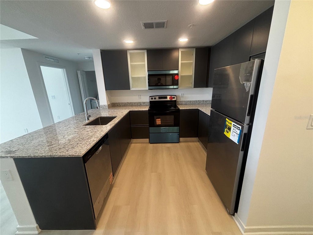 Photo of 5563 Millenia Park Boulevard #223, Orlando, FL 32839 (MLS # O6427495)