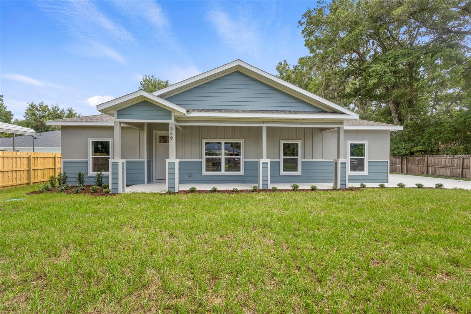 NEW CONSTRUCTION.
Make your dreams a reality with this new 4 bedroom, 2 bath, modern concept home with timeless charm.
Located in the quaint and sought after town of Lake Helen. Walking into this energy efficient home, you are greeted by the tall ceilings and an open concept living space. The chef’s kitchen is designed with ample workspace including quartz countertops, stainless steel appliances, undercabinet lighting and ample storage. The home boasts a spacious kitchenette, separate laundry room, large covered front and large rear porches, and a full two car garage. The Master suite includes a large walk- in closet, an ensuite featuring his and hers vanities with a walk-in shower and separate soaker tub. Solid wood cabinets with solid surface countertops and undermount sinks are installed throughout the home. Features an expansive lot with plenty of space to build your dream pool or garden oasis.
Located just outside the Historic District and free from HOA restrictions. This home blends style, space and flexibility without the hassle of HOA rules. The large mature trees maintain the historic charm with minimal restrictions. Lake Helen is close to shopping, dining, entertainment, Downtown DeLand, Sanford, Orlando, the beaches, and lots of activities for the entire family!
Don’t miss your chance to own a piece of paradise with endless possibilities.
Contact us now to schedule a personalized walk-through.