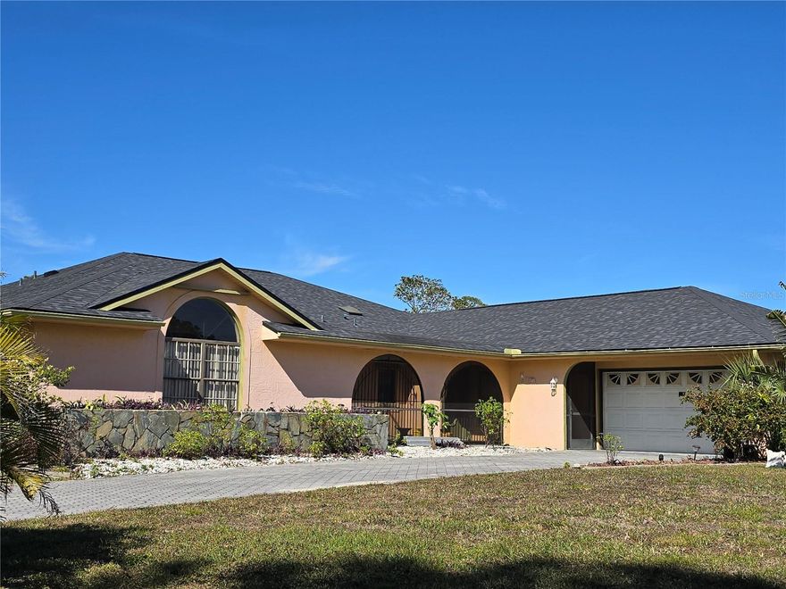 Beautiful 5 bedroom, 4.1 bath home situated on large corner lot.  Brand new roof, new AC, bar, formal living and dining rooms, courtyard, screened lanai.  Great for large and/or growing family.  Fruit trees and lush landscaped. Close to shopping.