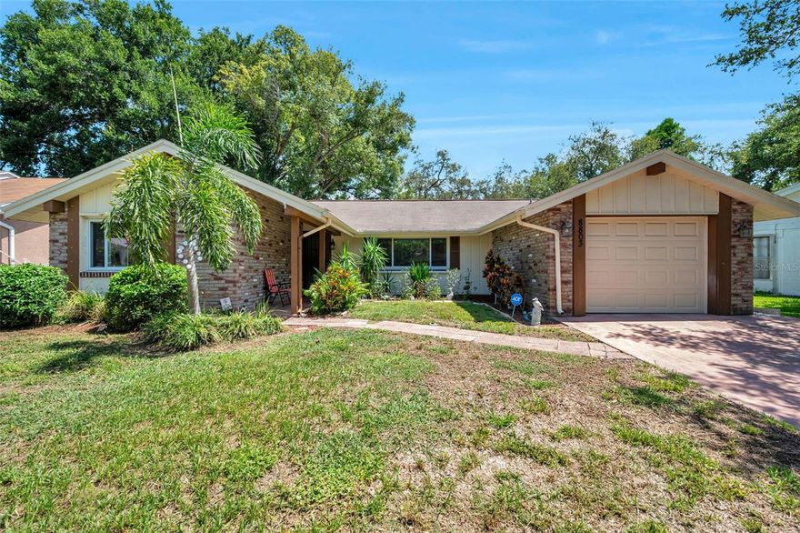 WELCOME TO YOUR AMAZING HOME at 8803 Mill Creek Ln, Hudson, FL in the PHENOMENAL community of Beacon Woods Village in Pasco County. Your SWEET home features 2 bedrooms, 2 bathrooms, 1 car garage with 1,334 heated sqft & 2,162 total sqft in a NO FLOOD, NO CDD & LOW HOA zone. SUPERB exterior features are DOUBLE-PANE, THERMAL TINTED, LOW E WINDOWS (5/2018), AC (5/2018), BRAND NEW ROOF (10/2025), NEW attic insulation (1/2026) & updated electrical system (11/2006). The curb appeal is VERY NICE with EASY, BREEZY TROPICAL LANDSCAPING, chain link fence in the back yard, double-wide driveway, private mailbox, rain gutters, carriage lights, covered front walkway & HURRICANE SHUTTERS for peace of mind during storms. Stepping inside, you'll LOVE how the LUXURY VINYL, WIDE-PLANK FLOORS make an ELEGANT statement (no carpet anywhere)! NATURAL SUNSHINE streams through the multiple windows ILLUMINATING the interior together with the MODERN light fixtures. The OPEN FLOOR PLAN consists of the kitchen, dining, living & family rooms. The REMODELED kitchen features CRISP cabinets with knobs, open shelving, BEAUTIFUL GRANITE counters, breakfast bar with overhead pendant lights, subway tile backsplash, tray ceiling with wood beams, pass through window to the screened lanai, deep undermount sink with gooseneck faucet, recessed lights & stainless steel appliances including a 4-door fridge, range with self-clean oven feature, microwave, dishwasher & disposal. Arrange your furniture in a variety of ways in the HUGE living room which effortlessly flows into the dining room with pretty chandelier & glass sliders to the lanai. There is a family room off the kitchen where you can spend quality time with your loved ones. The WONDERFUL primary bedroom can easily accommodate king size furniture & has a walk-in closet & en-suite. The private REMODELED bathroom consists of subway tiled ceramic floor, newer toilet with bidet, DUAL sinks, vanity wood cabinet with cultured marble counter & hexagon tile backsplash, shadow box framed mirrors, bright lights & SENSUAL shower with rain shower head, glass enclosure, matching hexagon tiled shower floor & wall insert for your beauty items. In this split bedroom plan, the front bedroom has a fan & spacious closet with sliding doors. The guest bathroom features a convenient tub/shower combo, dual shower heads with rain shower, subway tiles & cabinet with storage & cultured marble counter. There is a MARVELOUS screened & covered 36' long lanai to enjoy cool evenings & comes with a HEATED SPA where all your worries can melt away! This screened lanai features 2 ceiling fans & GRANITE breakfast bar off the kitchen window. The washer & dryer laundry machines are located in the garage & included in the sale. This EXQUISITE HOME can be sold FULLY FURNISHED & TURN-KEY FOR IMMEDIATE ENJOYMENT OF THE LUCKY NEW BUYERS!! Location is IDEAL near shopping centers, schools, restaurants, medical plazas, places of worship, beaches & tourist attractions. MAKE THIS YOUR FUTURE HOME!