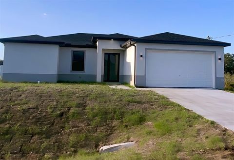 Photo of 3113 58th St, Lehigh Acres, FL 33971 (MLS # C7511746)