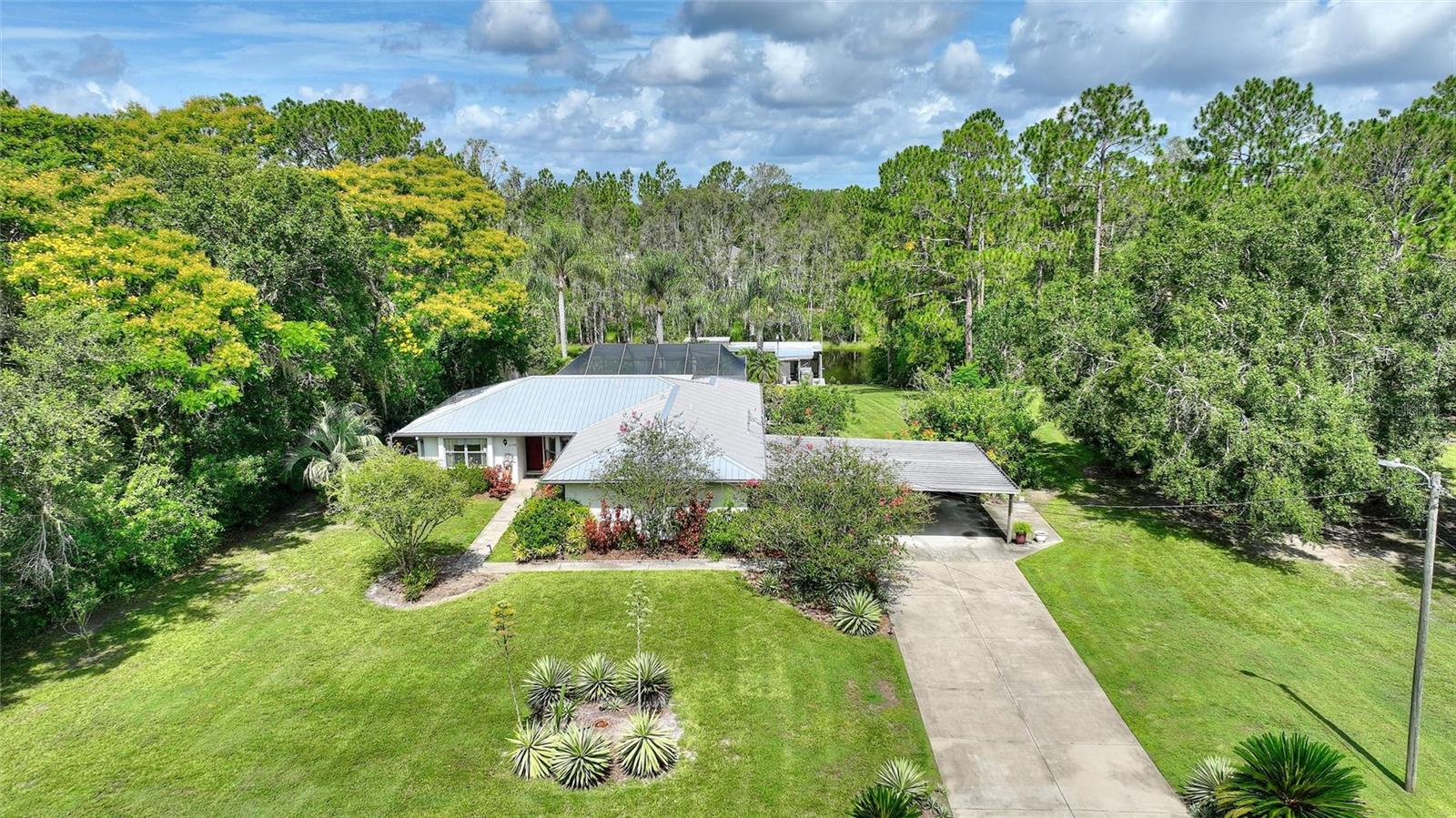 Charming Canal-Front Home on a Full Acre in Indian Lake Estates! Welcome to your own private garden retreat! Nestled on a full acre along the canal in the sought-after community of Indian Lake Estates, this 3-bedroom, 2.5-bathroom pool home offers the perfect blend of comfort, functionality, and Florida charm. From the moment you arrive, the picturesque front lawn and tranquil setting will capture your heart. Inside, you’ll find a spacious and thoughtfully designed layout with both formal and informal dining areas, a bonus/game room, and stunning outdoor living spaces. The great room features double pocket sliders that open to a fully enclosed patio with serene views of the pool and canal—ideal for entertaining or relaxing in privacy. The kitchen is bright and welcoming with ample cabinetry, two pantries, and a cozy breakfast nook. The updated master suite includes a walk-in closet, ensuite bathroom with tub and separate shower, and a peaceful ambiance. Two additional bedrooms and a full guest bath are located on the opposite side of the home for added privacy. One guest bedroom also opens onto the patio through sliding doors. The bonus room is a true showstopper—currently set up as a game room and bar with stool seating, wine cooler, refrigerator, and ice maker. Just outside the bonus room and off of the kitchen is a half bath and screened side porch, adding even more convenience and entertainment space. Step outside to the screened, in-ground pool, resurfaced in 2020, surrounded by lush landscaping and plenty of space for gatherings. At the rear of the property, is the boat house that has a newer roof and decking on the dock and provides easy access to Lake Walk In Water, just a 5-minute boat ride away—perfect for avid anglers or boating enthusiasts.*****Additional Features: Newer metal roof, exterior paint, HVAC system, fiber optic internet, four-station irrigation system, generator with home hookup, water softener, pool heater, pump cartridge filter and chlorinator. ****This peaceful, gated community is a hidden gem in Central Florida, centered around Lake Walk In Water, a 7,500-acre lake famous for its bass fishing. Residents enjoy a wide range of amenities, including:18- and 9-hole golf courses, Boat ramp and marina, Fishing pier (longest freshwater pier in Florida!), Clubhouse with fitness room, restaurant, library. ballroom and pro shop. Residents can enjoy tennis, basketball and pickleball. There is a playground for the little ones and a pavilion with picnic tables and grills on the lake side. ****Wildlife is abundant, and the area is perfect for those who love nature and serenity—yet you're just over an hour to Orlando, Tampa, Disney, and the Gulf Coast beaches. Don’t miss this unique opportunity to live your dream Florida lifestyle. Schedule your private tour today! Florida's Best Kept Secret!