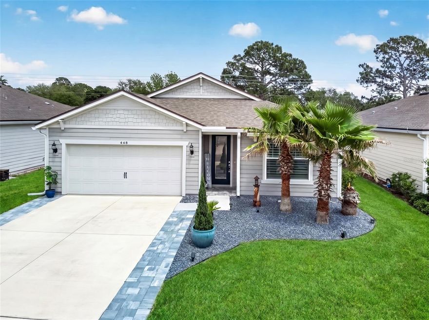 Welcome to this beautifully upgraded 2021-built home, offering modern comfort, thoughtful design, and an unbeatable location—all priced at $429,000. This spacious 4-bedroom, 2-bathroom residence is move-in ready and packed with high-end finishes throughout. Step inside to discover a bright, freshly painted interior featuring durable hard-surface flooring throughout the main living areas, with cozy carpeting in the bedrooms. The open-concept layout is enhanced by upgraded lighting fixtures, decorative accent walls, and ceiling fans in every room, creating a stylish yet comfortable atmosphere. At the heart of the home is a gourmet kitchen designed to impress, complete with granite counter tops, soft-close cabinets and drawers, a classic subway tile back-splash, and a true exterior-vented exhaust hood. You’ll also find a built-in Kitchen Aid oven and microwave, along with a large walk-in pantry that provides ample storage. Best of all—all appliances convey with the home. The primary suite offers a relaxing retreat, featuring a beautifully tiled shower with a built-in seat, subway tile finishes, and the same high-quality soft-close cabinetry and granite surfaces found throughout the home’s bathrooms. Outside, enjoy Florida living at its finest with an extended covered patio—perfect for entertaining or unwinding. The home also features durable Hardy Board siding, gutters, and a widened 6-foot driveway with attractive pavers leading to a 2-car garage with sleek epoxy flooring. Additional highlights include a whole-house duct cleaning completed in 2026, ensuring clean air and efficiency for years to come. Conveniently located just 8 minutes from Crescent Beach and only 15 minutes from historic St. Augustine, this home also sits within a top-rated school district and is close to local schools, making it ideal for families. This property truly combines modern upgrades, thoughtful details, and a prime location—ready for you to call it home.