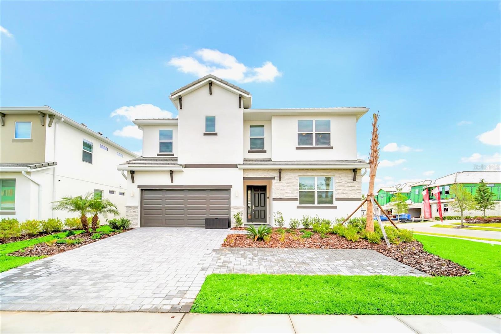 Exceptional 12-Bedroom, 11.5-Bathroom Residence in Kissimmee, Fully Furnished! This splendidly appointed home in Kissimmee is the pinnacle of luxury living. The lower level boasts a 2-car garage that's been converted into an arcade/ game room, an expansive open-concept kitchen featuring exquisite quartz countertops, high-end cabinetry, and top-of-the-line stainless-steel appliances. The kitchen is open to the family room and dinning room that flows into the oversized lanai and the SCREEN ENCLOSED POOL DECK. Whether you're hosting a BBQ, splashing around in the pool or just relaxing in the spa... This outdoor oasis is the perfect spot to unwind all year round. Upstairs there is a LOFT with Pool Table/ Lounge PLUS a Theater/TV space which is surrounded by the remaining bedrooms. The resort-like community includes a 24-hour guarded gate, a luxurious clubhouse, an expansive pool area complete with cabanas and a hot tub, a well-equipped fitness center, a playground, sand volleyball and basketball courts, a game room, and even a movie room. Don't miss this incredible opportunity – schedule your viewing today and immerse yourself in the ultimate in luxury living!