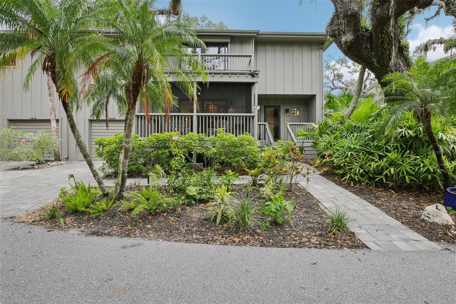Amazing value, nestled within the gated Landings community, this fabulous move-in-ready Treehouse offers a perfect blend of comfort, style, and convenience. Boasting 3 bedrooms and 2.5 baths, the home features hardwood flooring throughout, a convenient inside utility, and freshly painted interiors. Relax or entertain on the private, expansive screened porches, which serve as a seamless extension of the living spaces. A newly added backyard paver area enhances outdoor living, providing the ideal spot for grilling and enjoying the serene surroundings. Recent updates include two new air conditioning units, ensuring year-round comfort. Maintenance-free living is complemented by access to the community's nature trail and lush, mature landscaping. With shopping and restaurants just a short walk away, this home combines modern living with a tranquil setting.