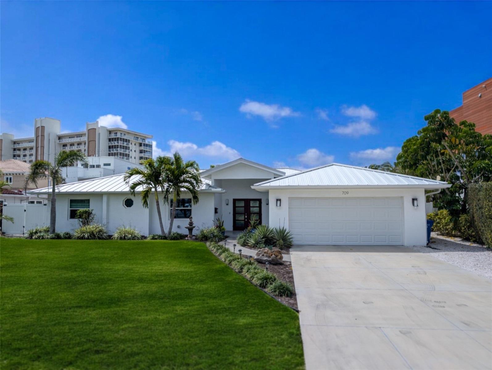 Welcome to 709 Valencia Rd, a beautifully remodeled home in the heart of Venice, FL. Completely renovated down to the studs in 2017, this charming property combines modern style, comfort, and outdoor living.
Inside, you’ll find spacious, light-filled rooms with high-end finishes throughout. The open living area flows seamlessly into the updated kitchen, which features sleek countertops, ample cabinet space, and high-end appliances—ideal for both entertaining and everyday living.
The cozy bedrooms provide a peaceful retreat, and the bathrooms have been tastefully remodeled with contemporary touches.
Step outside to your own private backyard oasis. The in-ground pool is the perfect place to unwind, while partial Gulf views provide a serene backdrop. Whether you're enjoying quiet moments by the pool or hosting family and friends, this space offers the best of outdoor living.
Located just about 130 yards from the beach, you’ll have quick access to the stunning Gulf coast, along with shopping, dining, and all that Downtown Venice has to give. This home truly has it all—don’t miss out on the opportunity to make it yours!