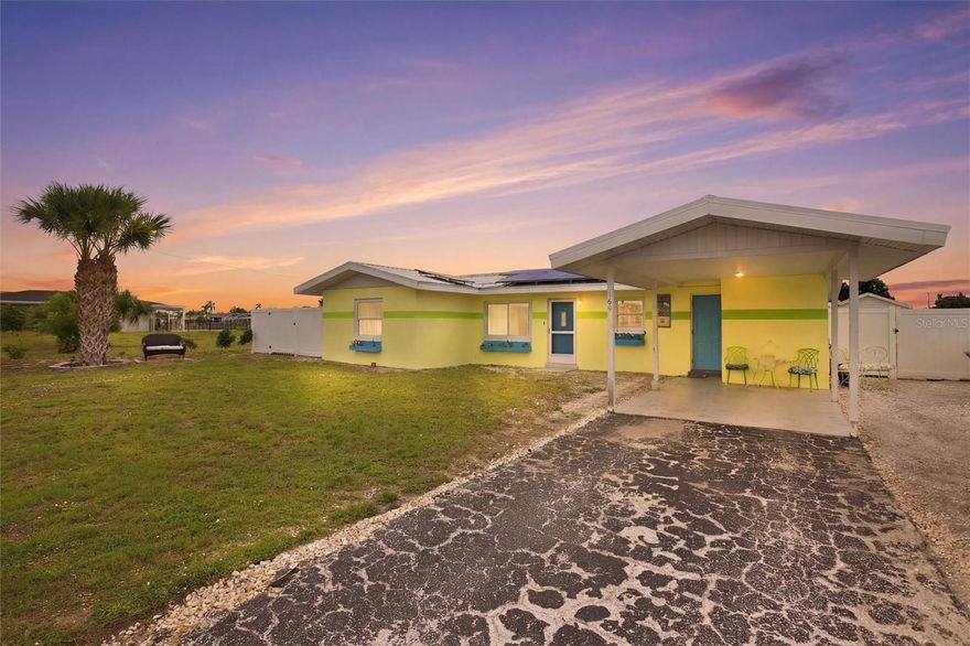 Welcome to this charming 3-bedroom, 2-bath waterfront pool home in the heart of Port Charlotte! From the moment you arrive, you’ll be captivated by its inviting coastal curb appeal, highlighted by a bright exterior palette and relaxed Florida style. Enjoy peace of mind with numerous recent updates, including a new metal roof (2023), photovoltaic solar system with Tesla Powerwall (2023), and A/C system (2021). Offering 1,304 square feet of living space, the home also features a spacious, fully fenced backyard—perfect for pets, play, or private outdoor enjoyment. The true centerpiece is the stunning waterfront setting. Expansive canal views and thoughtfully designed outdoor living spaces create the ultimate Florida lifestyle. A large deck spans the water’s edge, ideal for entertaining, dining, or simply unwinding while taking in the serene surroundings. Multiple seating areas and a manicured lawn lead seamlessly to the dock, making it perfect for boating, kayaking, fishing, or relaxing by the water. A screened waterfront gazebo with a metal roof elevates the experience, complete with a hammock, lounge seating, ceiling fan, and mounted TV—your own private retreat. Boating enthusiasts will appreciate approximately 80 feet of seawall and a wide canal with just one bridge to Charlotte Harbor, offering access to the Gulf of Mexico. Inside, the home is light, bright, and welcoming, featuring an open-concept living and dining area with neutral finishes and a clean coastal aesthetic. Large windows and sliding glass doors flood the space with natural light and open seamlessly to the screened pool and lanai, creating effortless indoor-outdoor living. Designed for year-round enjoyment, the pool area offers generous deck space for lounging and entertaining, all protected by a white aluminum screen enclosure, along with a covered seating and dining area for added comfort.
Durable, multi-tone wood-look tile flooring runs throughout—no carpet—combining style with easy maintenance. The updated kitchen showcases white raised-panel cabinetry with crown molding, granite countertops with a full-height matching backsplash, and a suite of brand-new stainless-steel appliances. A barn-style interior door adds character to the primary suite. The primary suite offers a relaxing retreat with direct access to the lanai and pool, along with an updated en-suite bath featuring a tiled walk-in shower with pebble flooring and a single-sink vanity. Two additional bedrooms share an updated guest bathroom with a freestanding clawfoot tub and a granite-topped vanity with a striking blue glass vessel sink. Step outside to a turfed side yard featuring a jasmine-covered outdoor shower. Additional highlights include a covered carport, cozy fire pit area, and an 8x12 utility shed. This waterfront property would make an excellent vacation rental or a relaxing weekend getaway. Ideally located in a desirable area of Port Charlotte, you’ll enjoy convenient access to Charlotte Harbor Beach Park and boat launch, as well as being just minutes from downtown Punta Gorda, Ponce de Leon Park, Fishermen’s Village, and all the shopping and dining along US-41 and Port Charlotte Town Center. Some of Southwest Florida’s most beautiful Gulf beaches—including Englewood Beach, Manasota Key, Boca Grande, and Venice Beach—are just a short drive away. Easy access to I-75 and Punta Gorda Airport adds to the home’s appeal. **PLEASE ENJOY THE 3D INTERACTIVE VIRTUAL TOUR ASSOCIATED WITH THIS LISTING**