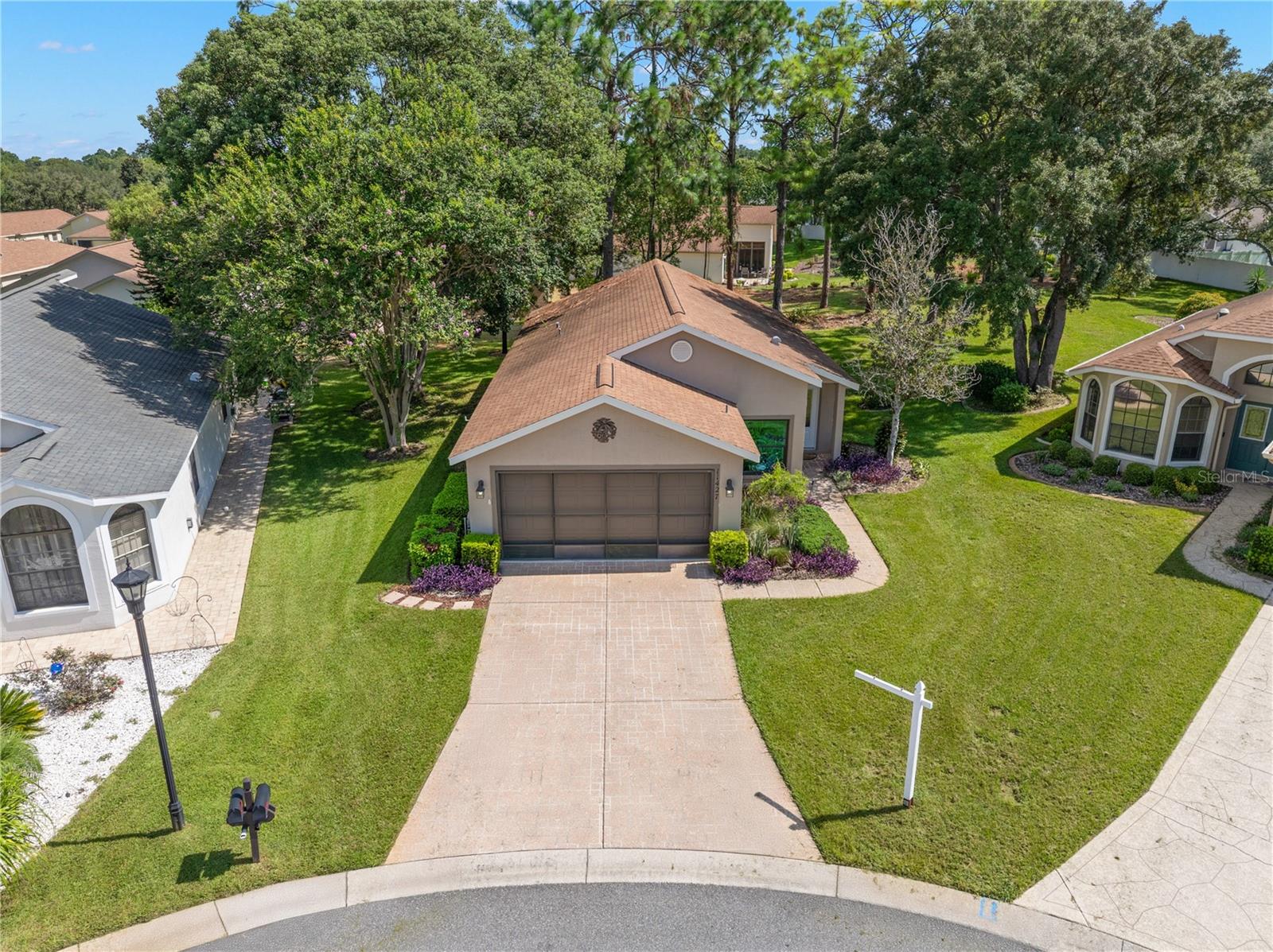 Welcome to this 55+ maintenance free lifestyle located in the GOLF CART and PET friendly location of Wellington at Seven Hills! This ACTIVE community offers a gated GUARD entry with amenities including outdoor HEATED swimming pool and spa, water aerobics, fitness center, billiards and more! There are many clubs including arts & crafts and many social clubs that include the Red Hat Society and Wellington Wanderers Travel Group! This single-family patio style property built by Ryland Homes sits on almost a 1/4” acre PRIVATE lot on a cul-de-sac with no backyard neighbors! The home offers a beachy cottage feel with updates that include new windows in the kitchen and living room (8/2025) that are dual color white white on the inside to match the interior and brown on the outside. They are Turtle Glass Technology allowing for less light transfer and added privacy and makes the home feel new again! The landscaping has been UPGRADED with the removal of overgrown plantings and installation of colorful and tropical plants! The newly installed front door with leaded glass window allows for natural lighting into the home! The foyer welcomes your guests and creates a drop zone and separation from daily living! The great room is just WOW! Vaulted ceilings, recessed lighting and LUXURY VINYL PLANK flooring throughout the entire home! The incredible kitchen has had the bi-level countertop removed and made one level with GRANITE countertops. There are white shaker style cabinetry with new hardware, under mount stainless steel sink, new faucet, new disposal and the appliances are approximately 4 years old and include an oven with Air Fry capability. There is an eat-in space in the kitchen as well as space for a desk or even a large furniture item for additional storage. The living room has built-ins that offer a place to showcase your treasures as well as house items that need to be tucked away! The split floor plan has a primary bedroom with a GRAND feel that fits king size furniture with ease and a transom window that provides natural lighting! The en-suite primary bathroom has a walk-in shower and has been given a facelift with a freshly painted vanity as well as new hardware and light fixtures. The second bedroom has quick access to the second full bathroom complete with a walk-in tub that has a handheld shower. Your living space is expanded into the Florida room through the French doors which can also be used as a THIRD bedroom if needed or keep as a lounging space, craft room or TV room. You can also close the BRAND NEW doors and use as a screen room! The backyard can be accessed from this space through a separate entrance/exit where up you can allow for your pets to play (there is no number or weight restrictions for pets)! Additional features and benefits include a roof installed (2016), newer HVAC with new motor fan motor, new washer and dryer, new interior paint including the interior doors, ceiling fans throughout, newer blinds, extended driveway and a low average electric bill ($140)! With 24/7 security, recreational facilities including a 15,000 sq. ft. clubhouse offering RESORT STYLE AMENITIES such as an OLYMPIC SIZE pool, a fitness center, PICKLEBALL, miles of trails for walking/biking and even enjoy a tasty meal at The Wellington Bar and Grill! Fees include lawn maintenance, exterior painting, roof repair/replacement, internet, cable and more!