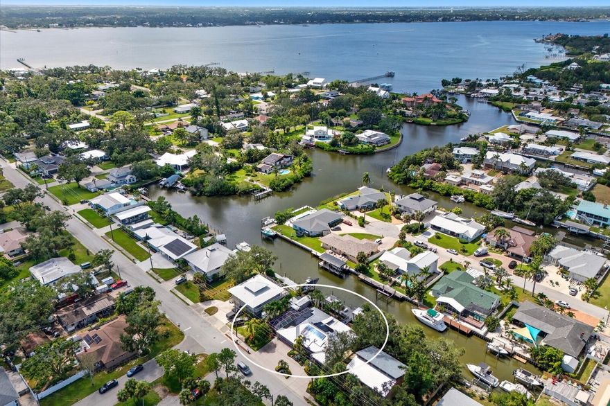 WOW WHAT A DEAL!!! STUNNING PALMETTO WATERFRONT POOL HOME THAT IS ABSOLUTELY MOVE-IN READY! Tucked away on a protected DEEP water canal with NO BRIDGES and direct access to the Manatee River, Tampa Bay, and the Gulf, this Key West inspired waterfront retreat is truly a boater’s dream. SELLER OFFERING HOME WARRANTY! From the moment you arrive, you’ll be captivated by the lush tropical landscaping and easy care xeriscape design that create a vibrant yet low maintenance setting. The striking curb appeal continues inside, where pride of ownership is undeniable. Beautifully maintained and thoughtfully updated, this home shines with meticulous care & attention to detail, a true showcase of quality and comfort for those who love life on the water! The great room design keeps your focus on the water views and natural light pouring in through the many windows and sliding doors. Gorgeous wood flooring adds richness throughout the main spaces, while a wood burning fireplace anchors the living area. The chef inspired kitchen exudes warmth and elegance with custom wood cabinetry, rich granite countertops, and a spacious center island perfect for entertaining. Stainless steel appliances, a built in wine cooler, and a sleek induction cooktop combine style and function, while under cabinet lighting and a designer backsplash add a refined touch. An open flow to the living and dining areas creates the ideal space for both everyday living and hosting with ease. The primary suite feels like a private hideaway with its spa-inspired bathroom, Norstone stone shower walls, custom double vanities, and charming beadboard ceilings. A multi-purpose bonus room adds flexibility with built-in office cabinetry, wine storage, a walk-in pantry, and additional laundry storage. The additional two bedrooms are generously sized and perfect for children or guests. Walls of glass in the sun-filled Florida room with eight sliding doors opening to the water,  blurring the lines between indoor and outdoor living. The screened-in pool is heated & chilled, offering the perfect place to relax after a long day. This property has NEVER EXPERIENCED FLOODING, providing peace of mind that many waterfront homes cannot match. The real magic of this home is found by the water — featuring a 60-ft composite dock with water, power, lights, a fish-cleaning station, and a 7,500-lb boat lift. For larger vessels, the dock provides 5 foot depth at low tide plus a 15/30/50-amp power station, making it ready for yachts up to 60 feet. Behind the home, a tropical backyard oasis unfolds with a low-maintenance riprap seawall, palms and native plantings, and a dockside lounge with built-in swings and Bluetooth speakers. Additional perks include a fantastic shed that doubles as a tackle locker and a covered outdoor area perfect for grilling. With NO HOA OR DEED RESTRICTIONS, it’s perfectly suited for a full-time residence, seasonal escape, or high-performing short term rental. Centrally located just minutes from Sarasota, Bradenton, St. Petersburg, and Tampa — with quick access to beaches, airports, and dining. Ride your bike to the 365-acre Emerson Point Preserve on Snead Island, offering nature trails, kayaking, and sunsets. The nearby Bradenton Yacht Club features a swimming pool, social events, boating amenities & dining. With its laid-back atmosphere, natural beauty, & strong sense of community, Palmetto is truly a special place...and this property is more than a home...it’s a way of life!
