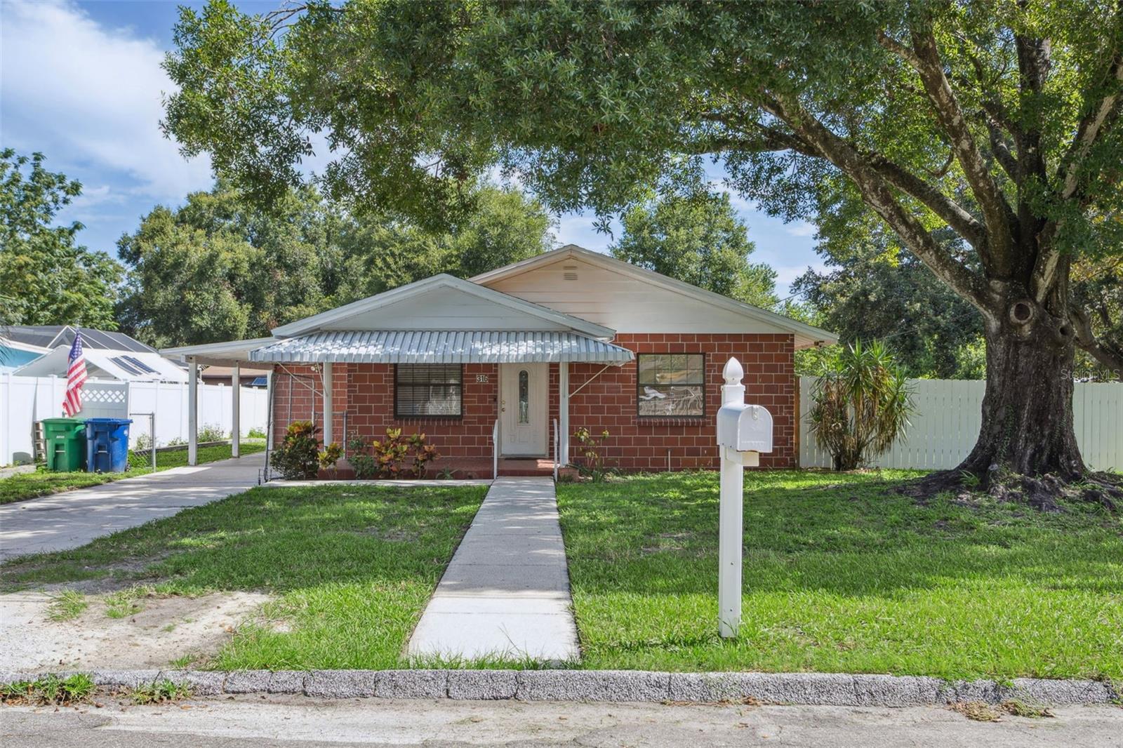 A solid newly updated home, with a huge fenced double lot yard, perfect for a large shop, boat storage, or 2nd garage. The owner already has a hookup with electric, water and sewer for a camper or RV. The owner (an HVAC professional) replaced the ductwork and AC system after his purchase of the home, along with the plumbing lines, a full interior renovation. The roof was replaced in 2015 so insurance won't be a problem for the new owner either. This is a great home, with large rooms, covered front porch, separate laundry room, and a very usable floor plan. I think you'll love it :)
