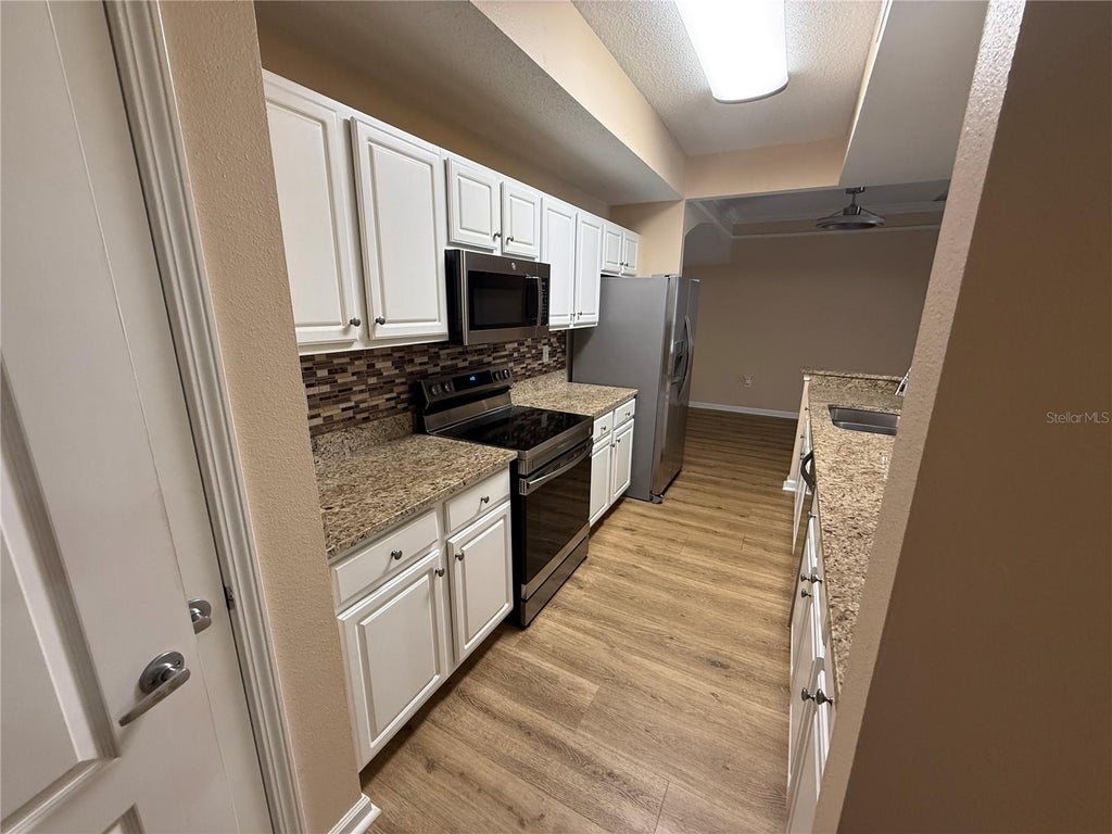 Photo of 12021 Villanova Drive #111, Orlando, FL 32837 (MLS # O6445764)