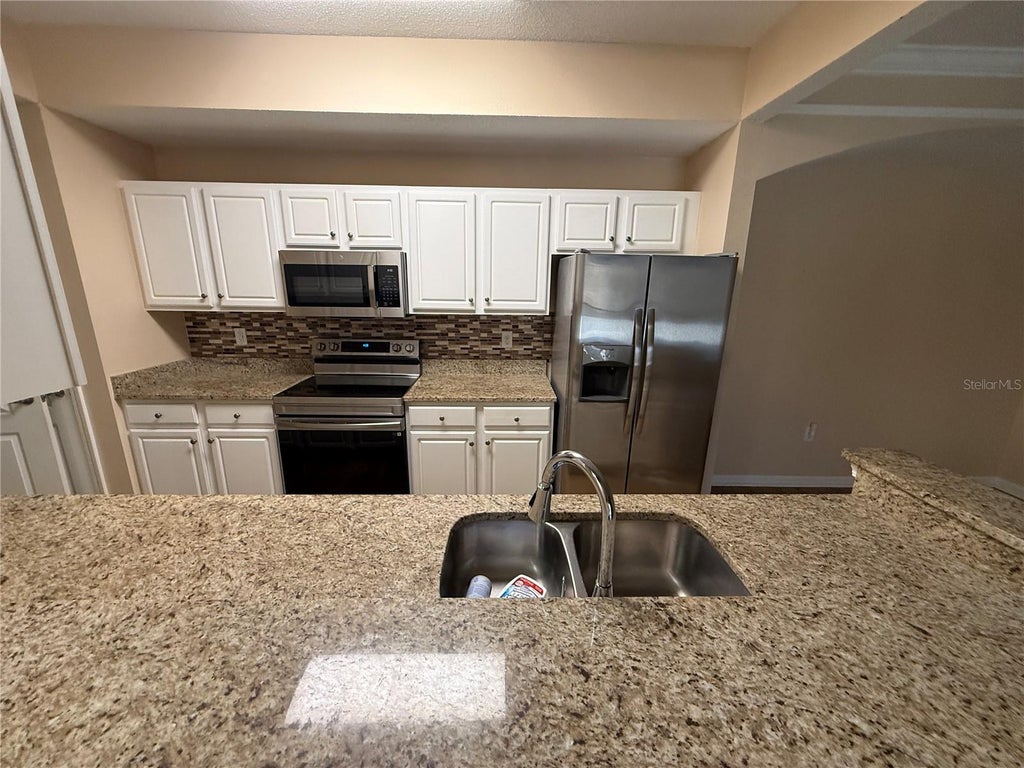 Photo of 12021 Villanova Drive #111, Orlando, FL 32837 (MLS # O6445764)