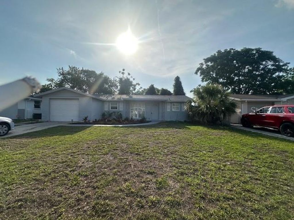 Photo of 10840 Norwood Avenue, Port Richey, FL 34668 (MLS # TB8441238)