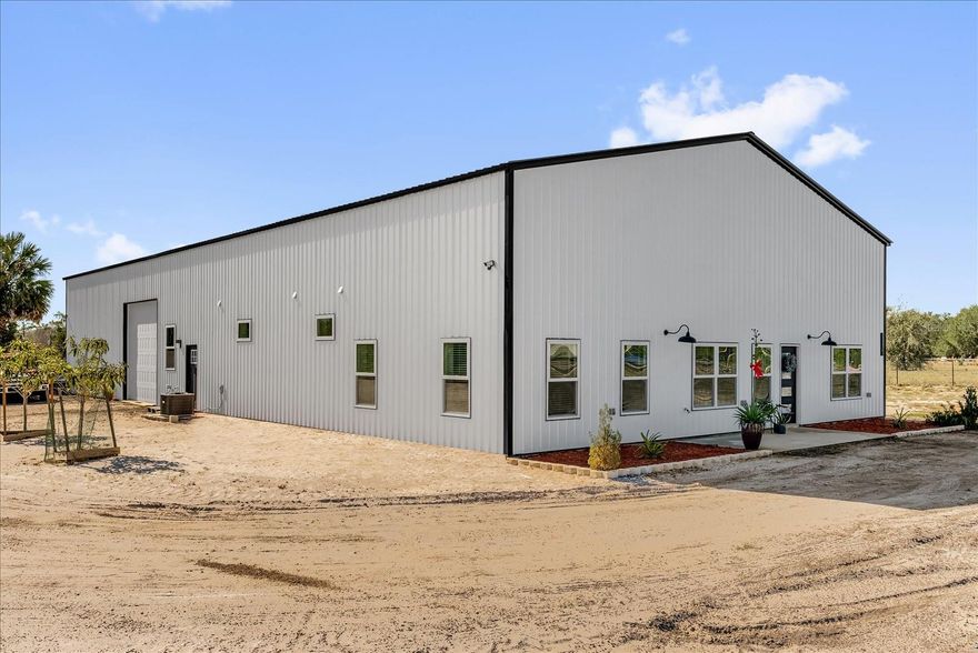 Luxury Barndominium (5000 sqft) with three(3) Master bedrooms, Garage (3000 sqft) with NO-HOA on 2.5 acres. Built in 2023, this custom-made barndominium offers refined modern living on 2.5 fully fenced acres, combining upscale finishes, open-concept design, and unmatched functionality. The home features 2,090 sq ft of living space with three(3) spacious Master bedrooms, each with a private attached bathroom, plus another half bath in the garage with an air-conditioned office (8x12ft). The kitchen and dining area are highlighted by a 19-foot high ceilings, upgraded California-style quartz countertops, 42 inch tall cabinets and a 36-inch gas range with six burners, ideal for both everyday living and entertaining. Ceramic tile flooring flows throughout the home, complemented by a two-door Samsung refrigerator, gas water heater, gas dryer, watwer softener for the whole house with 3 layer filtration and a 500-gallon propane tank. Designed with comfort and quality in mind, the property includes a whole-house water softener with three-stage filtration and a reverse-osmosis system at the kitchen sink. A 4-ton, 14-SEER heat pump split system provides efficient climate control year-round. 
A true highlight of this property is the approximately 3,000 sq ft oversized garage, capable of accommodating up to 10 vehicles. The garage features a 12’ x 12’ door, a Titan PREMIER Series 9,000-lb clear-floor 2-post lift, and an air-conditioned 8’ x 12’ office with a half bath, making it ideal for car collectors, hobbyists, or live-work use. Bring your RV, boat, toys, or business ideas. This one is built for flexibility, space, and modern comfort. Offering privacy, space, and modern luxury, this one-of-a-kind property delivers a rare opportunity to own a high-quality barndominium with both lifestyle appeal and exceptional versatility.