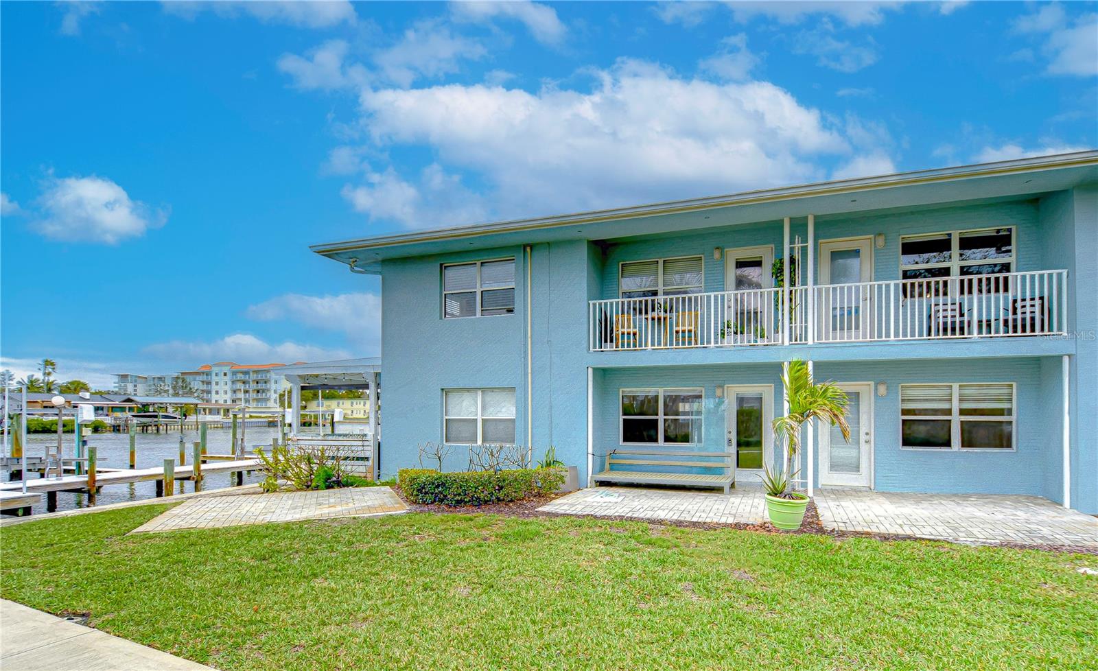 WATERFRONT CONDO WITH PRIVATE BOAT SLIP. Beautifully renovated condo just a short distance to the Intracoastal Waterway and Gulf of Mexico. This one bedroom, one bathroom condo is on the second floor and stayed high and dry during the hurricanes. The community boasts a dock and this unit has its own custom drive on dock by JetDock that measures 23'4'x8'4'. Enjoy the water view while relaxing on your covered balcony. No expense spared with this high end renovation. The kitchen boasts stainless steel appliances, sparkling grey countertops, white shaker cabinets with crown moulding, soft close doors and drawers, an impressive faucet. Luxury vinyl plank flooring throughout, barn doors going into the bathroom and bedroom, ceiling fans, blinds, custom built in closets, and tiled walk in shower with glass door. All new duct work and AC replaced in 2024 along with a new roof in 2022. Perfect location between Clearwater Beach and Downtown Dunedin. Waterfront dining, shops, parks, and restaurants right around the corner.