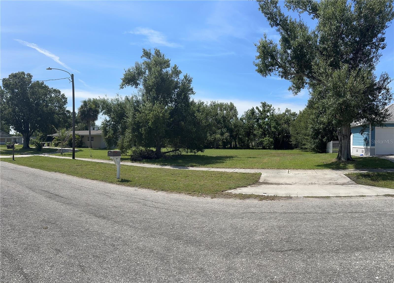 Free mangoes included — no, really. This Punta Gorda lot comes with its very own mature mango tree, so while you're building your dream home, you can start bragging that your land literally produces. This is the lot every serious buyer has been waiting for. Located in the heart of Punta Gorda’s highly sought-after historic district, 413 E Henry Street is more than just a vacant lot — it's a rare and valuable opportunity to build with confidence. Fully cleared and situated within city limits, this property offers a major advantage: the water meter is already installed and active, which means the water impact fee has already been paid — saving you time, money, and hassle. That’s an instant benefit most vacant lots simply can’t offer.
Even more appealing, a home once stood on this site, so much of the groundwork has already been laid. With utilities nearby, a level surface, and no demolition or clearing needed, this property is truly shovel-ready. Zoned TPG-TR (Traditional Neighborhood), it offers flexible design options, and with no HOA or deed restrictions, you have the freedom to build your vision without limitations.
And don't forget the sweet bonus, the mature mango tree on-site — perfect for backyard shade and fresh Florida fruit. (Just imagine picking your own mangoes while your neighbors fight over theirs at the Punta Gorda farmer’s market.)
Surrounded by charm and convenience, this location places you just minutes from downtown Punta Gorda, Fishermen’s Village, TT Tiki's Bar & Grill and don't forget the entertainment, Harbor Event Center, the scenic Harborwalk, parks, restaurants, and top-rated schools. Whether you're a builder looking for your next profitable project or a future homeowner ready to create your dream space in a walkable, waterfront community — this lot is a must-have. Properties like this are few and far between, and when they do come to market, they don’t stay long. Act quickly — this one won’t wait.