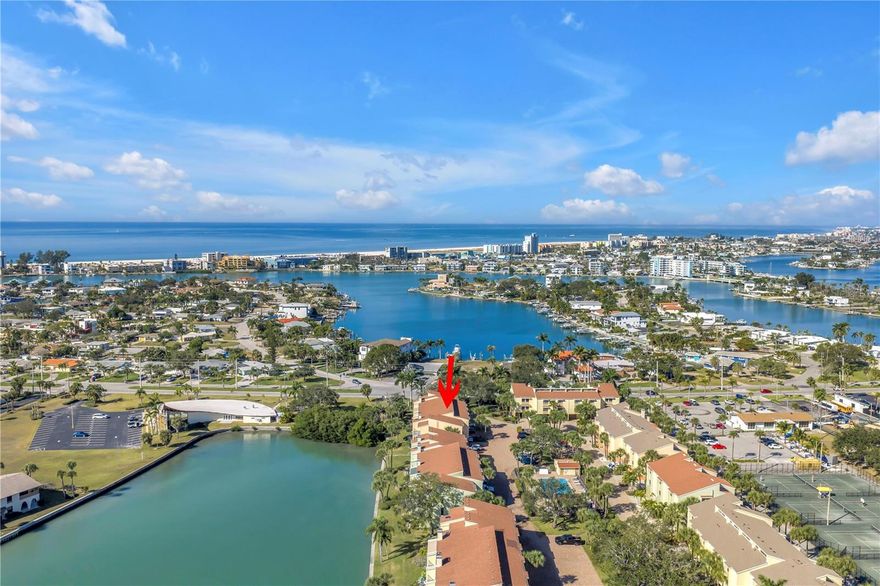 Welcome to coastal living in Treasure Island, a true Norman Rockwell beach town known for its charm, community festivals such as Sanding Ovations, Kite Festivals, Drum Circle, 4th of July Celebrations, to name a few. This elevated 2-bedroom, 2.5-bath townhouse offers secure waterfront living with everyday views that make you exhale.
The main living level features an open layout with a cozy fireplace and its own private balcony overlooking the canal—perfect for morning coffee, afternoon wine or sunset breezes. The kitchen is expansive with an oversized pantry and a large breakfast bar wonderful for entertaining family and friends over the Holidays.  The spacious primary suite includes a large ensuite bath, generous walk-in closet, and a private waterfront balcony, creating a peaceful retreat with sweeping water views. A second bedroom and bath offer comfort for family or guests.
On the ground level, the bonus room sits right at the water’s edge, ideal for a home office, fitness area, studio, or quiet lounge with front-row canal views. From here, it’s common to see dolphins and manatees passing through along with many different species of birds—your very own daily nature show.
The community offers brick-paved grounds, two sparkling swimming pools, and a marina with first-come, first-served slips for owners.
Right next door, the Treasure Bay Golf & Tennis Center brings even more recreation to your doorstep, offering tennis courts, golf, pickleball, rentable clubhouses, and year-round activities for both children and adults.
This location truly delivers the best of Florida living. And when the beach calls? You're only 1 mile from the white sands of the Gulf, easily close enough to walk, bike, or enjoy a relaxed evening stroll.
A perfect blend of waterfront tranquility, beach-town charm, and resort-style amenities — Competitively Priced, its time to add this home to your Must-See List today!
