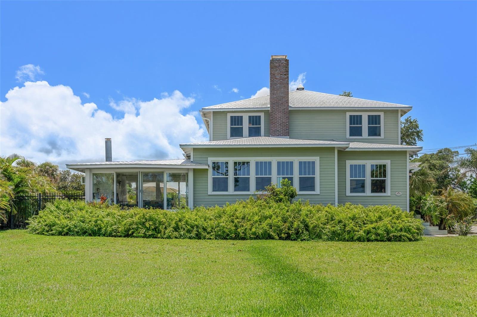 Welcome to a rare offering—an elegantly remodeled, historic two-story home perfectly positioned along the riverfront. Seamlessly blending timeless character with modern luxury, this turnkey residence is a coastal dream come true.
This spacious home features 5 bedrooms and 3 bathrooms, including two en-suite bedrooms—one conveniently located on the main floor—providing flexible living for guests or multi-generational needs.
From the moment you arrive, you'll be captivated by the charm and thoughtful updates throughout. The home has been fully renovated, featuring custom hurricane-rated windows, a newer roof, and fresh exterior paint that enhances its graceful curb appeal.
Step inside to discover a sprawling floor plan designed for both intimate family moments and grand entertaining. The heart of the home is the expansive chef's kitchen—a culinary masterpiece boasting a commercial-grade gas range, generous prep space, and custom cabinetry. Welcome to a rare offering an elegantly remodeled, historic two-story home perfectly positioned along the riverfront. Seamlessly blending timeless character with modern luxury, this turnkey residence is a coastal dream come true.
This spacious home features 5 bedrooms and 3 bathrooms, including two en-suite bedrooms, one conveniently located on the main floorproviding flexible living for guests or multi-generational needs.
From the moment you arrive, you'll be captivated by the charm and thoughtful updates throughout. The home has been fully renovated, featuring custom hurricane-rated windows, a newer roof, and fresh exterior paint that enhances its graceful curb appeal.
Step inside to discover a sprawling floor plan designed for both intimate family moments and grand entertaining. The heart of the home is the expansive chef's kitchena culinary masterpiece boasting a commercial-grade gas range, generous prep space, and custom cabinetry.
Nearly every room frames tranquil river views, filling the space with natural light and coastal serenity. Enjoy rocket launches and daily sightings of dolphins and manatees from the comfort of your home.
Outdoors, enjoy a private dock, perfect for boating, paddle boarding, or simply relax in your sun room as you watch the sun dip below the horizon. Enjoy your newly updated back deck as you grill or soak in the sun. Whether you're entertaining or unwinding with family, this home offers an exceptional lifestyle on the water.
No detail has been overlooked in this meticulously cared-for property. This is riverfront living at its finest move-in ready and waiting to be your forever home.