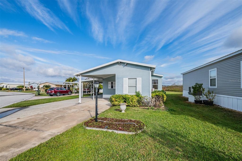 Photo of 6827 S Lake Henry Drive NE, Winter Haven, FL 33881 (MLS # TB8464788)