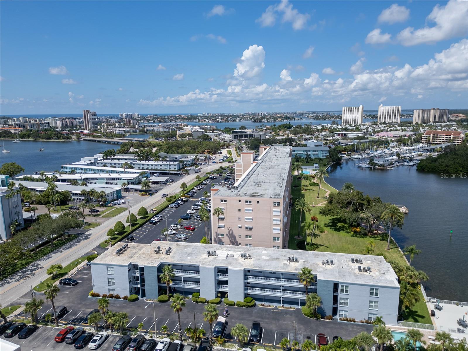 Coastal Charm Meets Modern Convenience at Casa Prima. Welcome to your waterfront sanctuary in South Pasadena. This beautifully updated 1 bedroom, 1 bath condo offers effortless affordable coastal living on the serene Boca Ciega Bay. Whether you're seeking a primary residence, a seasonal escape, or an investment property, this fully furnished (optional), move in ready unit is a rare find in a highly desirable location. Positioned as a corner unit on the second floor, this light-filled condo features a spacious bedroom with a walk-in closet and an open living space with updated finishes throughout. You’ll love the stylish luxury vinyl plank flooring, cool white brick accent walls, contemporary lighting, and fresh paint which give the unit a clean, modern feel. The kitchen and bathroom have been upgraded with sleek quartz countertops and classic subway tile. Electric panel new 8/22. Washer and dryer are allowed in the unit and are also available on each floor. Conveniently located near the elevator, laundry room, and storage closets, the unit comes with a designated parking spot and guest parking. Everything is in place to move in or start generating rental income immediately. Community Amenities & Features: Casa Prima is a welcoming, pet-friendly community, with no age restrictions and allows rentals—perfect for seasonal visitors or investors. The low monthly HOA covers essential services like water, sewer, trash, cable, WiFi, and flood insurance, providing peace of mind and simplified living. Recent community-wide improvements include: a resurfaced heated pool, a new elevator, and updated seawall and dock. Unmatched Access & Connectivity: From this peaceful waterfront setting, you’re only minutes from the fantastic dining and culture of downtown St. Petersburg and the charming boutiques and restaurants of Gulfport. Two international airports, Tampa and St. Pete/Clearwater, are just a short drive away, making travel a breeze. Just a mile from the sugar white sands of St. Pete Beach and moments from Fort DeSoto’s scenic trails and kayaking adventures, this location delivers the best of the Gulf Coast lifestyle: nature, relaxation, and vibrant local culture all at your doorstep. Whether you're planning to settle in or looking for a well-placed investment, Casa Prima offers the perfect mix of comfort, location, and lifestyle. Your waterfront retreat is waiting! Please note: part of the condo community (not this unit) is under construction and showings are by appointment only. Check out the 3D tour and contact us today https://tinyurl.com/ybrxmy84.