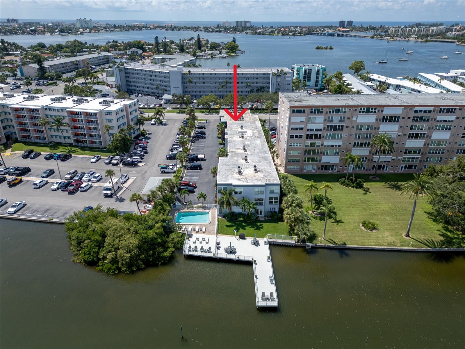 PRICE REDUCED. BELOW MARKET VALLUE! FULLY FURNISHED (OPTIONAL) WATERFRONT CONDO! REMODELED AND NESTLED ON BOCA CIEGA BAY. Coastal Charm Meets Modern Convenience at Casa Prima. Welcome to your waterfront sanctuary in South Pasadena. This beautifully updated 1 bedroom, 1 bath condo on the 2nd floor (top floor), in an elevator building, offers effortless affordable coastal living. Whether you're seeking a primary residence, a seasonal escape, or an investment property, This move in ready unit is a rare find in a highly desirable location. Positioned as a corner unit on the second floor, this light-filled condo features a spacious bedroom with a walk-in closet and an open living space with updated finishes throughout. You’ll love the stylish luxury vinyl plank flooring, cool white brick accent walls, contemporary lighting, and fresh paint which give the unit a clean, modern feel. The kitchen and bathroom have been upgraded with sleek quartz countertops and classic subway tile. Electric panel new 8/22. Washer and dryer are allowed in the unit and are also available on each floor. Conveniently located near the elevator, laundry room, and storage closets, the unit comes with a designated parking spot and guest parking. Everything is in place to move in or start generating rental income immediately. Community Amenities & Features: Casa Prima is a welcoming, pet-friendly community, with no age restrictions and allows rentals—perfect for seasonal visitors or investors. The low monthly HOA covers essential services like water, sewer, trash, cable, WiFi, and flood insurance, providing peace of mind and simplified living. Recent community-wide improvements include: a resurfaced heated pool, a new elevator, and updated seawall and dock. From this peaceful waterfront setting, you’re only minutes from the fantastic dining and culture of downtown St. Petersburg and the charming boutiques and restaurants of Gulfport. Two international airports, Tampa and St. Pete/Clearwater, are just a short drive away, making travel a breeze. Just a mile from the sugar white sands of St. Pete Beach and moments from Fort DeSoto’s scenic trails and kayaking adventures, this location delivers the best of the Gulf Coast lifestyle: nature, relaxation, and vibrant local culture all at your doorstep. Whether you're planning to settle in or looking for a well-placed investment, Casa Prima offers the perfect mix of comfort, location, and lifestyle. Your waterfront retreat is waiting! Please note: part of the condo community (not this unit) is under construction. Check out the 3D tour and contact us today https://tinyurl.com/ybrxmy84.