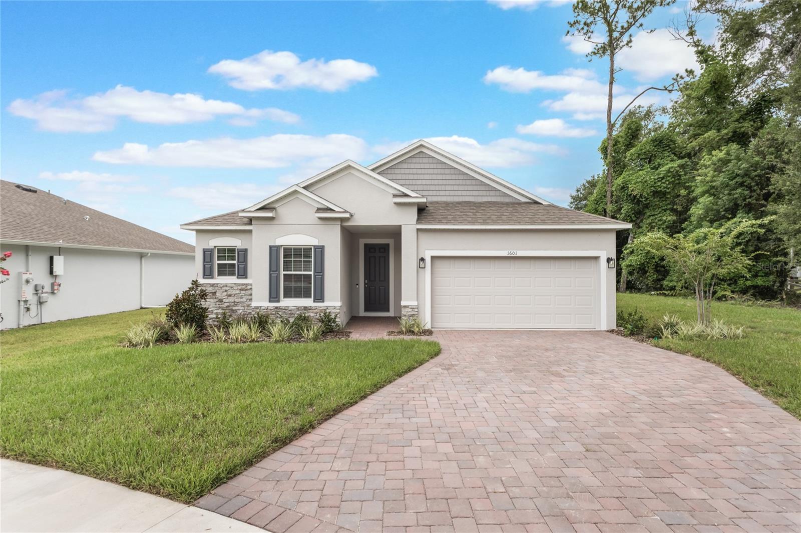 Don’t wait to Build! Welcome to this MOVE-IN READY 2025 Maronda home - Drexel Model located on a beautiful cul-de-sac lot in a private, one entrance community. Step inside the foyer and follow the hallway past the second and third bedrooms to the open living area. The island kitchen includes stainless steel appliances, double ovens, pantry, an eating bar, perfect for casual meals and the breakfast nook offers a great start to your day. The primary suite is a true retreat, boasting a luxurious bathroom and spacious walk-in closet. This 3 BEDROOM, 2 BATHROOM home is also complemented by a FLEXIBLE SPACE that can serve as an office, playroom, or whatever fits your lifestyle, a COVERED PATIO, FENCED-IN BACKYARD, and a 2 CAR GARAGE. UPGRADES: Vinyl Fence, Crown Molding throughout main area and Primary Bedroom, TILE Flooring throughout entire home, Quartz Countertops in Kitchen and Bathrooms, French Doors to the flex room, Smart Home Package (one app to power your entire home). Just 3 miles away from the historic downtown Deland, where you can enjoy food, shopping and fun. Daytona, New Smyrna and Ormond Beach – all within a 40-minute drive. St. John’s Marina in Deland is a local haven for outdoor fun with boat access and a large RV campground. Stetson University, a nationally ranked college, is in Central Deland. Local restaurants to enjoy, The Table Restaurant, Half Wall Deland, Cress Restaurant, the Deland Stockyard or The Parched Oak!