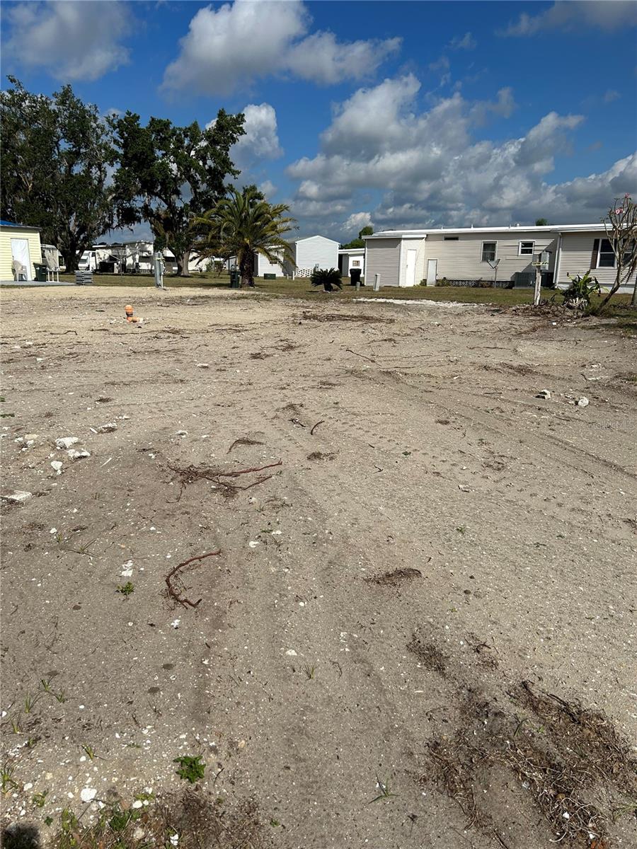All reasonable offers will be considered!! Vacant Mobile Home Lot in the sought after Holiday Park 55+ Community in the growing area of North Port. A mobile home park where you own the land your home sits on. This is a larger corner lot on a cul-de-sac ready for your new manufactured home. Home that was there was removed. The water, electric & sewer are capped off going to the road. Yearly Maintenance Fees of $1556.16 are included in the property tax bill & payable to the county. Start Living the Florida Lifestyle and enjoy the many amenities offered in this Gated Community.