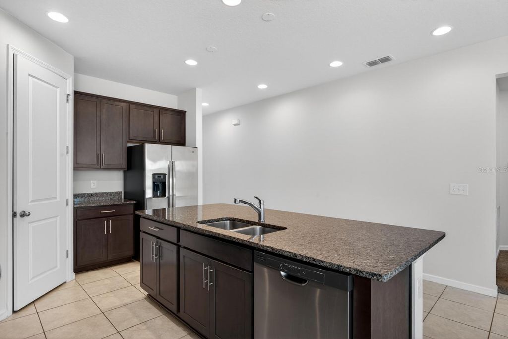 Photo of 689 Meadow Pointe Drive, Haines City, FL 33844 (MLS # O6401838)
