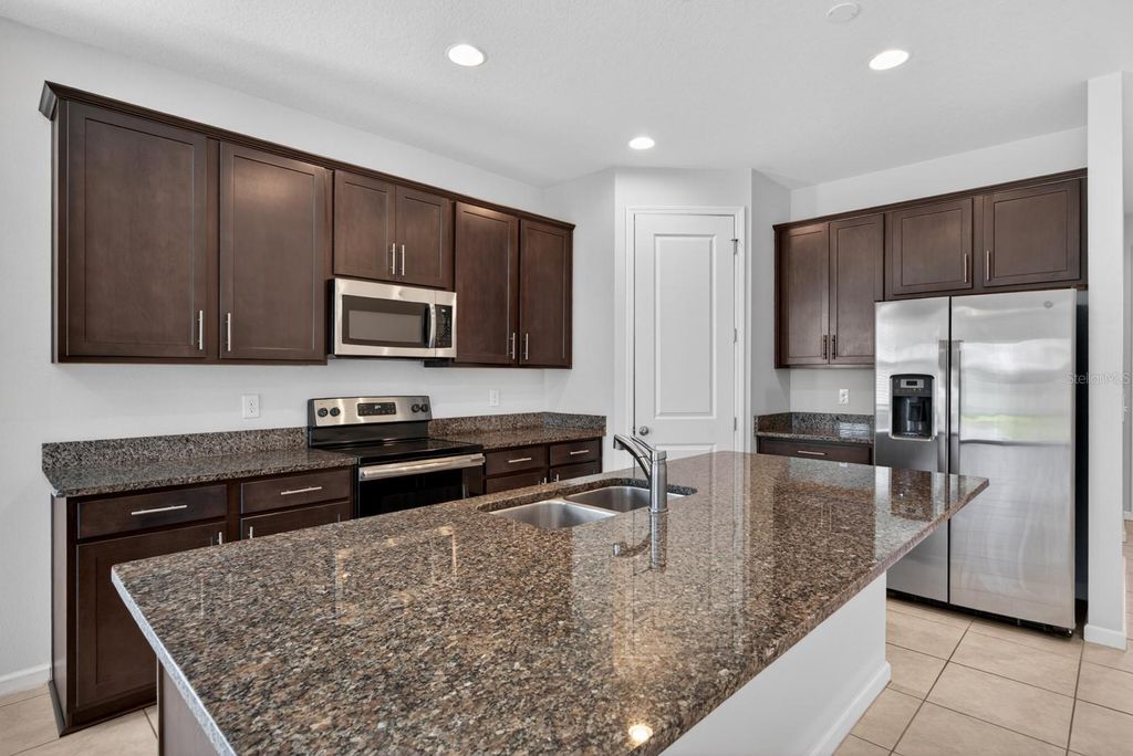 Photo of 689 Meadow Pointe Drive, Haines City, FL 33844 (MLS # O6401838)