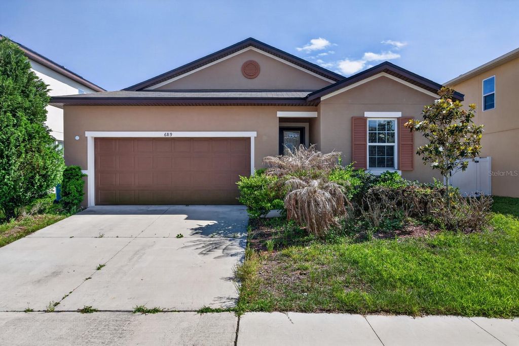 Photo of 689 Meadow Pointe Drive, Haines City, FL 33844 (MLS # O6401838)