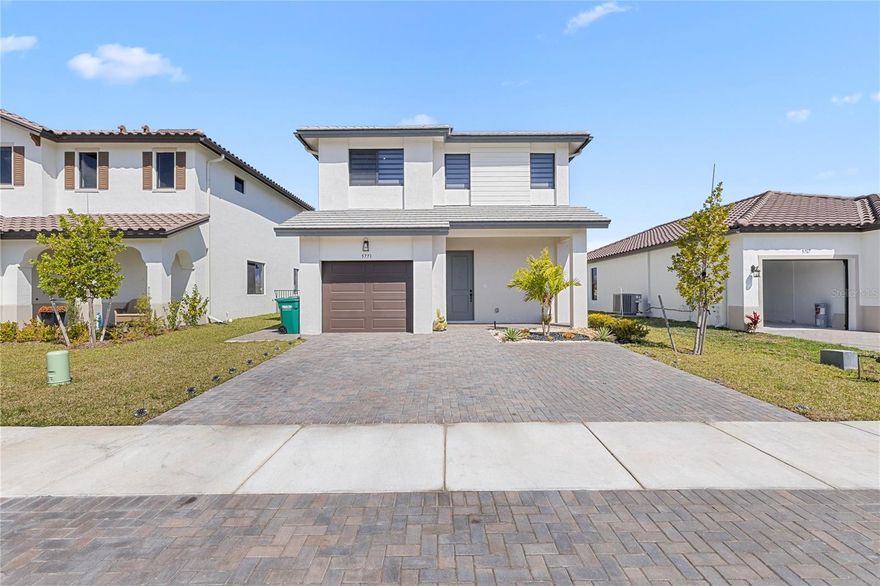 What a Gem in Ave Maria!

Welcome to this beautifully upgraded 2025-built lakefront home in the heart of Ave Maria. Rarely lived in and meticulously maintained, this 3-bedroom, 2.5-bath residence feels like new construction — without the wait. Designed with both style and functionality in mind, this home features an open-concept floor plan with crown molding throughout the first floor, upgraded backsplash, designer pendant lighting, and 36-inch cabinetry with soffits and lighting. Two built-in wine racks add the perfect touch for entertaining. Enjoy seamless indoor-outdoor living with an extended patio overlooking serene lake views, plus remote-controlled blinds on the patio sliders and in the primary bedroom for added convenience and comfort. The upgrades continue with custom-built primary closets featuring wood plank accents, upgraded cabinet hardware throughout, built-in entryway cut-outs, and ample storage solutions — including built-in garage cabinetry. The extended driveway wraps around for convenient garbage can placement, adding both practicality and curb appeal. This move-in ready home combines thoughtful upgrades, modern finishes, and tranquil waterfront living-all in one of Southwest Florida’s most desirable communities. Residents indulge in resort-style living with access to a sparkling swimming pool, state-of-the-art fitness center, tennis courts, and picturesque walking and biking trails. Just minutes from Ave Maria’s inviting town center.