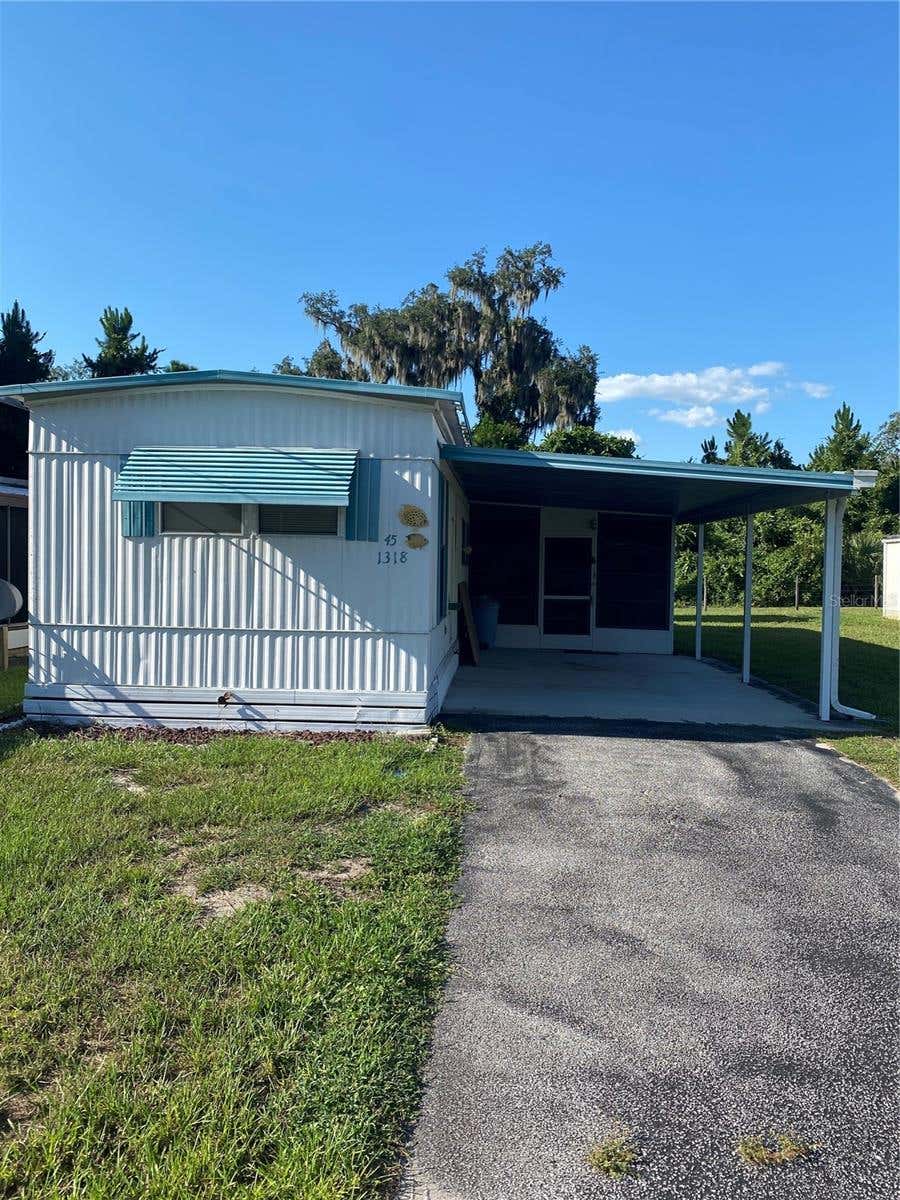 Photo of 1318 Cr 461, Lake Panasoffkee, FL 33538 (MLS # O6423014)