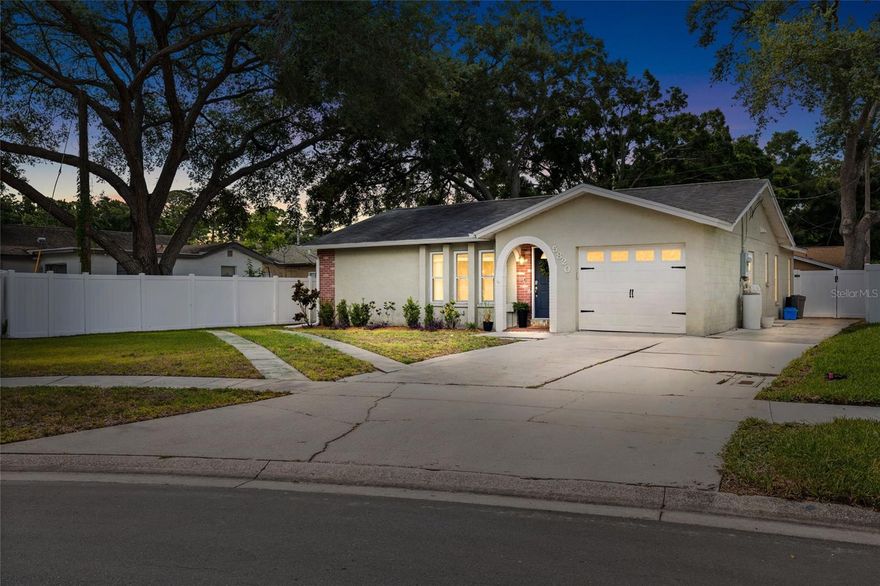 Under contract-accepting backup offers. One or more photo(s) has been virtually staged. Multiple Offers Received!  Highest and best due by 4pm on 5/16/26.  Welcome home! This bright and inviting single-story 3 bed, 2 bath gem offers 1,242 square feet of thoughtfully updated living space in a peaceful, quiet dead-end neighborhood — with big perks inside and out. Inside, you’ll love the porcelain wood-look tile flowing through the living area and  sizable primary bedroom, plus updated kitchen and bathrooms that are move-in ready. Natural light fills every room, giving the home a warm, airy feel. Step outside to your showstopper — a massive 300 sq ft screened and windowed lanai with brand new porcelain tile, perfect for entertaining or relaxing year-round. A pass-through window from the kitchen makes serving up drinks and snacks at the lanai bar a breeze, keeping the party flowing inside and out. The sizable backyard is fully fenced with a newly installed vinyl fence (2026), and there’s serious parking for all your toys: an oversized one car garage, an RV-sized pad plus room for cars and a boat, too. Major systems are already done for you: brand new AC and ductwork, roof (2019), and updated electric panel (2020). And here’s the cherry on top — this home may qualify for an assumable VA loan at just 2.25%, a rare opportunity in today’s market (buyer must have their own VA eligibility to be able to assume loan due to sellers need to reclaim their VA funding). Ideally located close to shopping, dining, both St. Pete and Tampa airports, and just 10 miles to the beach. Come see it — you won’t want to leave!