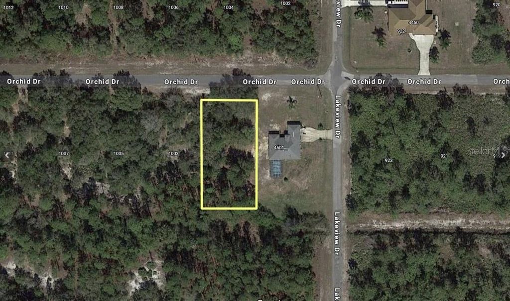 Photo of 1003 Orchid Drive, Indian Lake Estates, FL 33855 (MLS # P4937312)