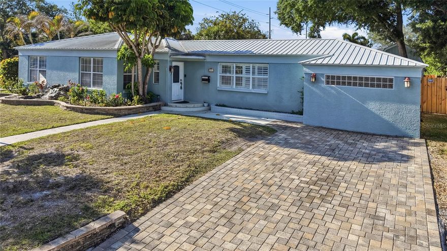 Situated on an oversized corner lot in the heart of South Tampa, this beautifully designed single-story home offers the perfect balance of space, functionality, and lifestyle, all just moments from Bayshore Boulevard and everything South Tampa has to offer.

Featuring a spacious four-bedroom, three-bathroom split floor plan, the home is designed with both everyday living and entertaining in mind. The expansive open-concept layout seamlessly connects the main living areas, creating an inviting space ideal for hosting, large families, or simply enjoying room to spread out.

The kitchen is equipped with stainless steel appliances, a large island with a built-in wine fridge, and a versatile bonus space currently used as a homework station, easily adaptable to fit your needs.

The primary suite offers a private retreat with its own full bathroom and cedar closet, while the additional bedrooms are thoughtfully positioned with access to a separate full bath. A third full bathroom is conveniently located with direct access to the paver pool deck, perfect for effortless indoor-outdoor living.

Step outside to a fully fenced backyard featuring a beautiful in-ground pool and ample green space, ideal for entertaining, play, or future customization. The property also includes a detached shed with electrical and a second-story storage area, providing exceptional flexibility and functionality.

Located in a non-flood zone, this property combines peace of mind with an unbeatable South Tampa location and endless potential to make it your own.