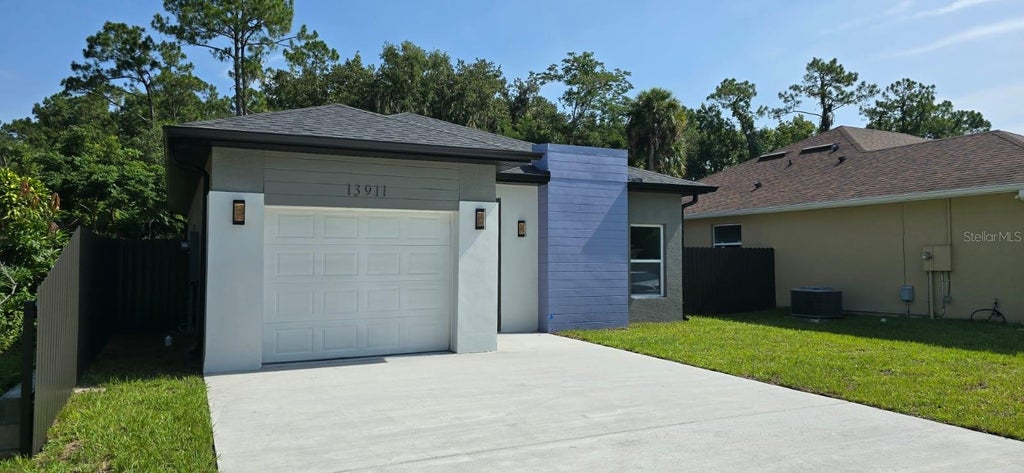 Photo of 13911 Ginger Creek Boulevard, Orlando, FL 32826 (MLS # O6439788)