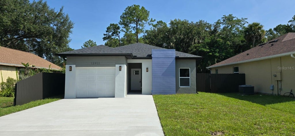Photo of 13911 Ginger Creek Boulevard, Orlando, FL 32826 (MLS # O6439788)